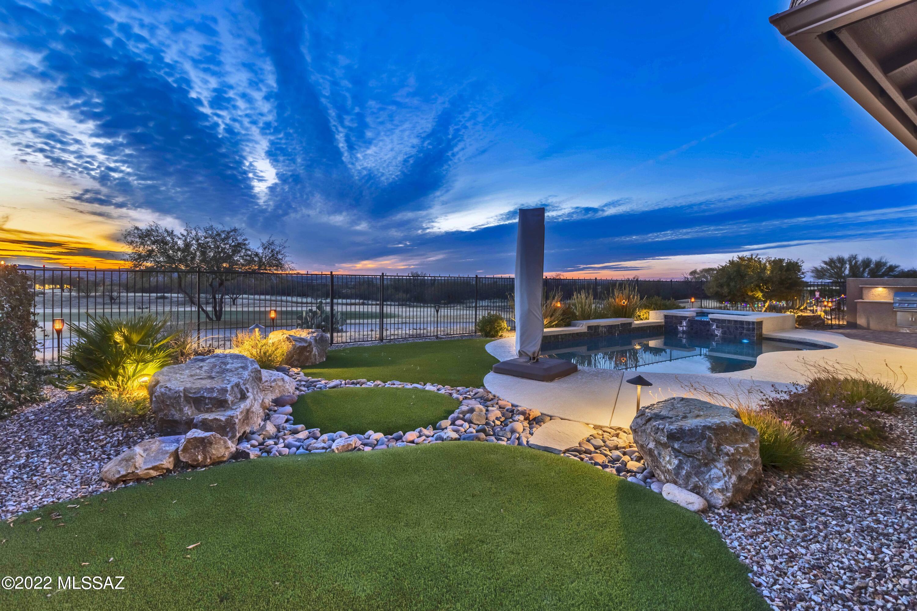 Views, Views, Views! Fantastic and rare opportunity in the heart of SaddleBrooke Ranch.  This spectacular Tesoro with a pool/spa is a dream come true. Overlooking the 7th fairway, you will enjoy views of the mountains, amazing Arizona sunsets, and the picturesque golf course. Chef's kitchen offers a generous island, upgraded quartz countertops, designer backsplash and upgraded Stainless Steel appliances. The tranquil primary suite is spacious and boasts a lavish bath with double vanity sinks, spa like walk-in shower and two separate walk-in closets with custom cabinetry. Split floorplan features an inviting guest bedroom with an en-suite bath for your guest's privacy. Multi-Purpose den can be a TV room, a craft room, or an office. Expanded full 3 car garage has an abundance of storage and plenty of room for your cars, golf carts and other toys. Completed in 2019, this home is expanded in all the right places. The covered patio with cozy gas burning fireplace includes custom roller shades leading to the spacious yard, beautifully fenced with a built-in barbeque and glistening pool. This home has everything you would ever want to live the best desert lifestyle. Don't wait to live the dream.