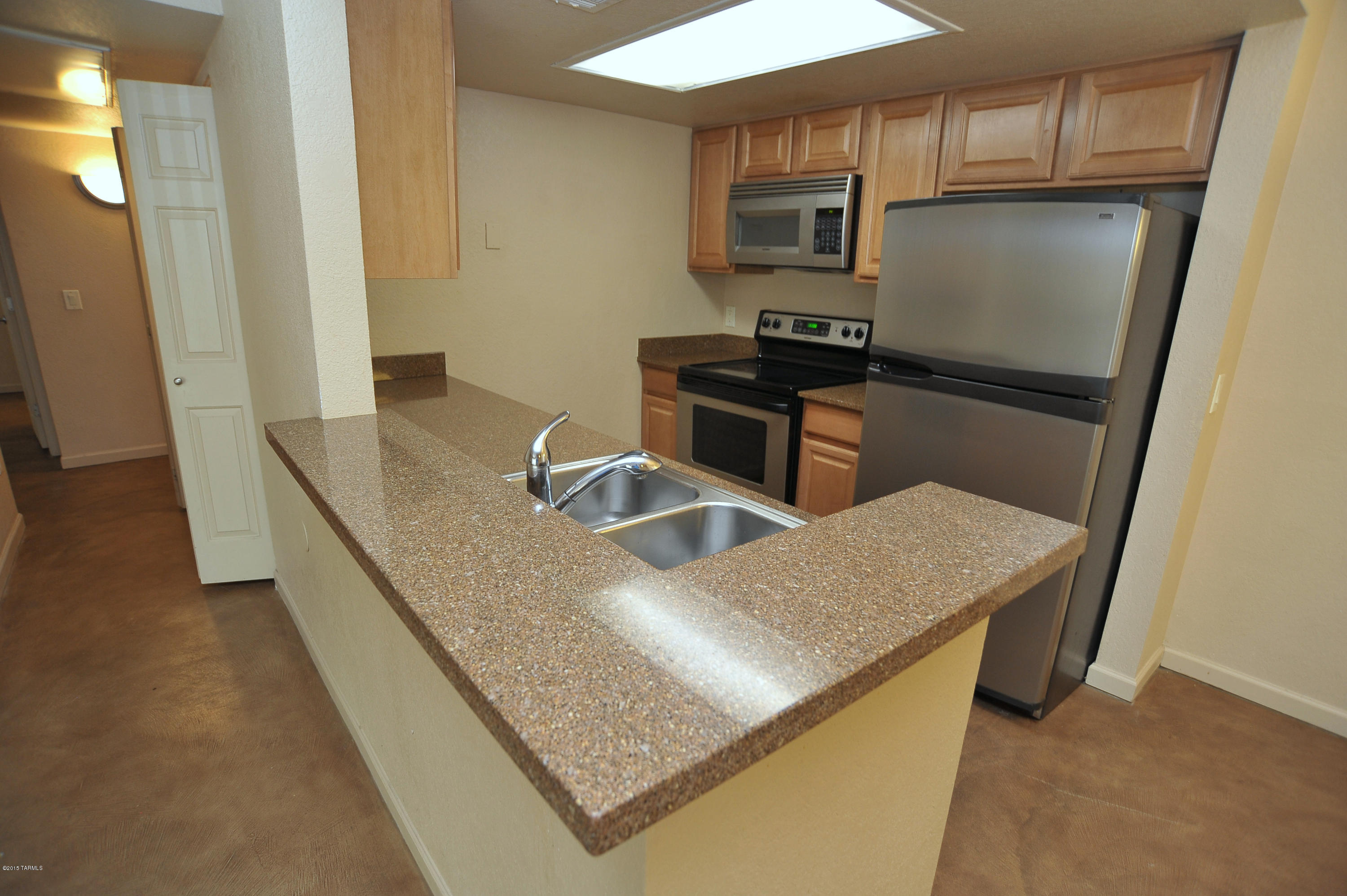 Range price listing seller will accept or counter offers between $100,000 and $110,000. Resort living in beautiful Starr Pass!This downstairs end unit is conveniently located next to the pool and amenities.Stained concrete flooring throughout,stainless steel appliances,maple cabinets.Great room floor plan with a fireplace,extra storage,covered patio, professionally painted.All the resort amenities: pool, spa,clubhouse,walking paths,tennis courts,walking distance to golf an JW Marriot resort.Ideal for investors, winter visitors or year-round enjoyment;close to downtown, Pima and U of A. This well maintained property is a Golfers dream.Water is included in HOA,lower than average electricity bills for this unitunit. Extr fronitlookingcon