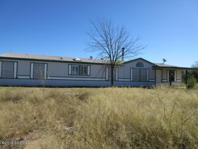 Large open floor split floor plan. Enter into a large living area with fireplace and built in book shelf. Dinning area, kitchen with island, and family area. Master bedroom features a sliding glass door that leads to an open patio, a den or small office, large master bathroom. Covered back patio, fenced yard for kids, animals or to keep the wild life from your garden. Views of the mountains.