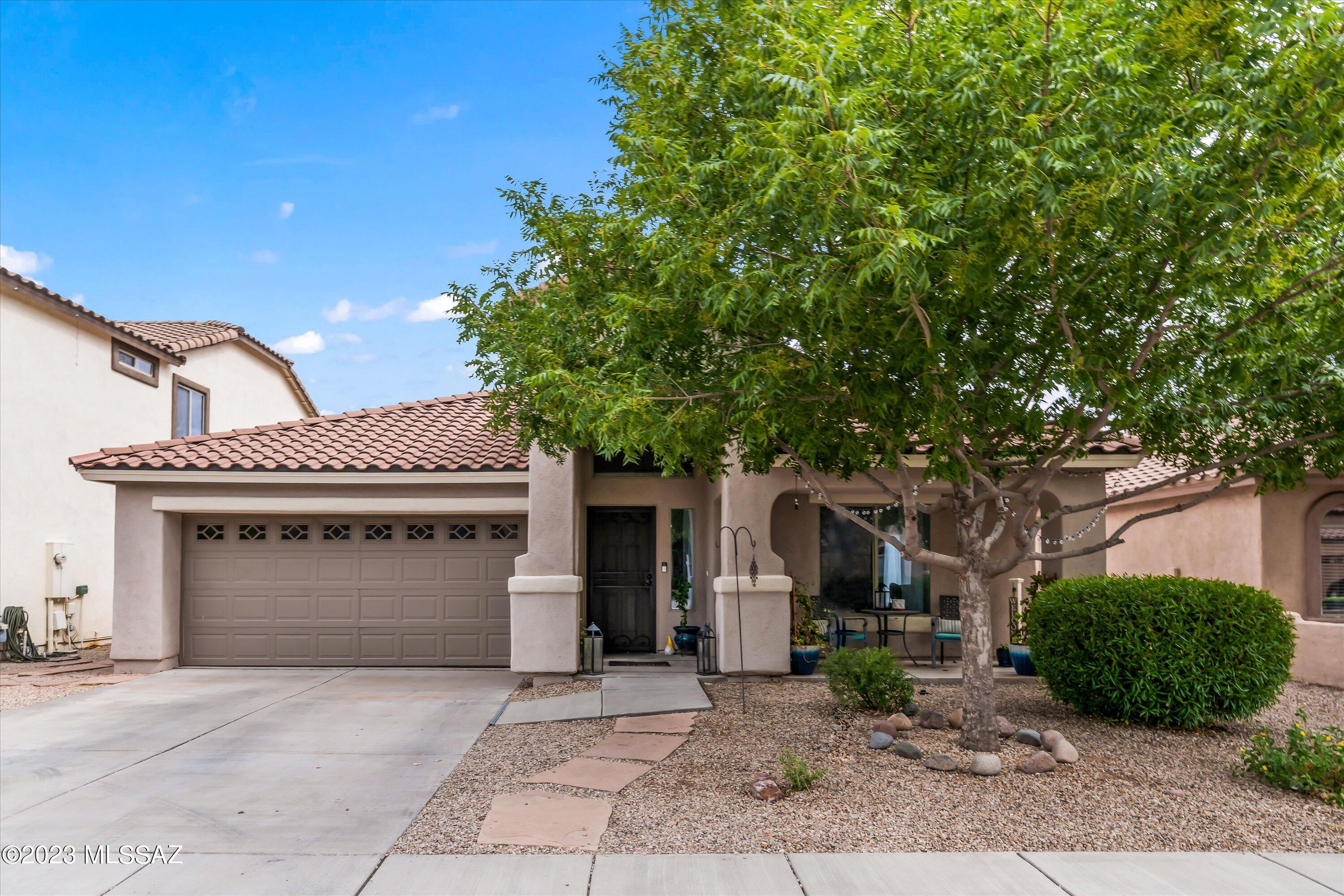 Beautiful and well maintained 2149 Sq Ft, 3 bedroom plus den, 2 bath, one story home. The shaded front yard welcomes you into the bright living room. Clean and crisp eat in kitchen with white cabinets, extra seating at the center island, stainless steel appliances, gas range, and walk in pantry. Gather in the adjoining family room with its slider door to the covered patio. Relax in your master suite with dual vanities, large shower and walk in closet. Laundry room with storage. Other nice touches include: great open floorplan, decorative arches throughout, farmhouse lighting fixtures and gorgeous wood look tile floors. Walled in backyard with pavers is ready for your personal touch. Great neighborhood amenities. Easy access to I-10 with lots of shopping and dining close by.