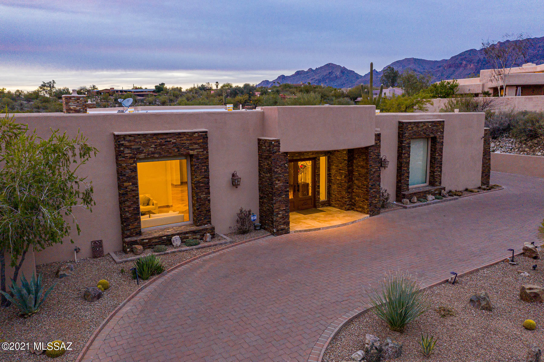 Majestic Catalina Foothills home. Classy and spacious with a flexible floorplan to cover all needs. The amazing kitchen is the heart of this home highly appointed and large enough to involve everyone in the cooking! Open floorplan, high ceilings with quality touches. Spacious master, and 4 ensuite bedrooms with bathrooms and large walk-in closets plus several have access to a private patio. Office or 6th bedroom. Pre-plumbed wine room ready to be designed to Buyer's wishes. Twinkling city lights to downtown Tucson and majestic Catalina views from the pool outdoor kitchen and dining areas 2nd master option. 4 car garage- This home has all the space you need!