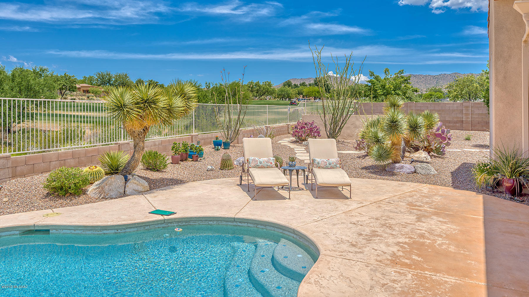 Beautiful Tierra model sited on spacious corner lot. Inviting courtyard w/mtn view welcomes you. Spacious greatroom w/corner fireplace overlooks the golf course & pool. Kitchen has granite counters, breakfast bar & plenty of built-in storage & is open to the nook. Butler's pantry features wet bar, ice maker, & large pantry. Formal dining is just steps away. Guest suite with 2 bedrooms & Jack 'n Jill bath. Master suite with private den/office & spacious en-suite with double closets, dual vanities, walk-thru shower & jetted tub. Ceramic tile throughout, convenient laundry, powder room & full 3 car garage. Outside is a fantastic pool overlooking the golf course, large covered patio, mature landscaping, putting green & plenty of privacy. Come see the best of SaddleBrooke Preserve's lifestyle!