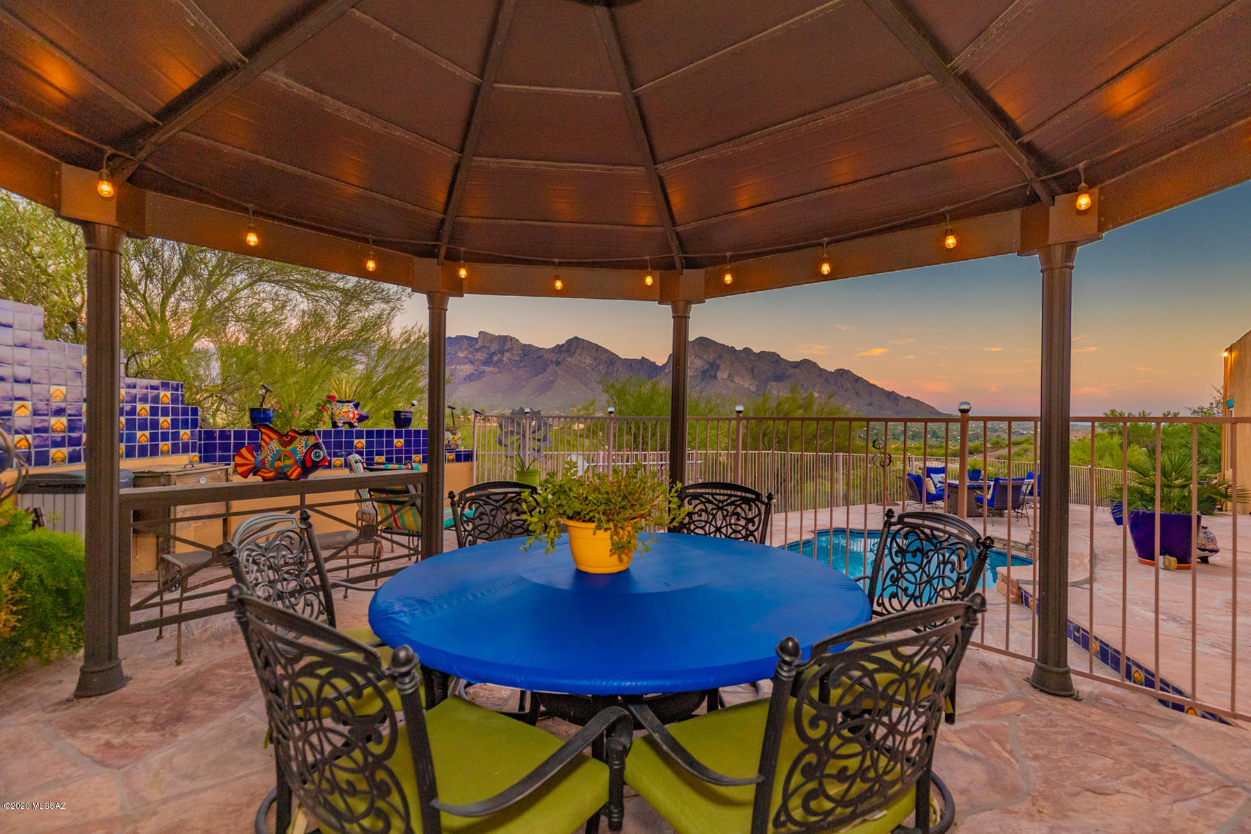 Southwestern living with Spectacular Mountain Views from inside and out! A Private, Tranquil Retreat that calls you to come back home and lounge on the patios, at the pool w/your favorite beverage, or on cooler evenings, relax indoors by the cozy fireplace with a great book and some hot chocolate! Updated, Upgraded Custom Home in the heart of Oro Valley!  Stainless appliances, Beautifully updated Talavera Tile Bathrooms, Kitchen, Fireplace; Tile flooring, split bedroom layout. Roof recoated 2018, The Zoned HVAC's updated; Low E DP Windows 11/2019. See List of Amenities in Documents Tab. Also see Plans and HOA approval to add third Garage. A Move-In Ready, Gorgeous Home!