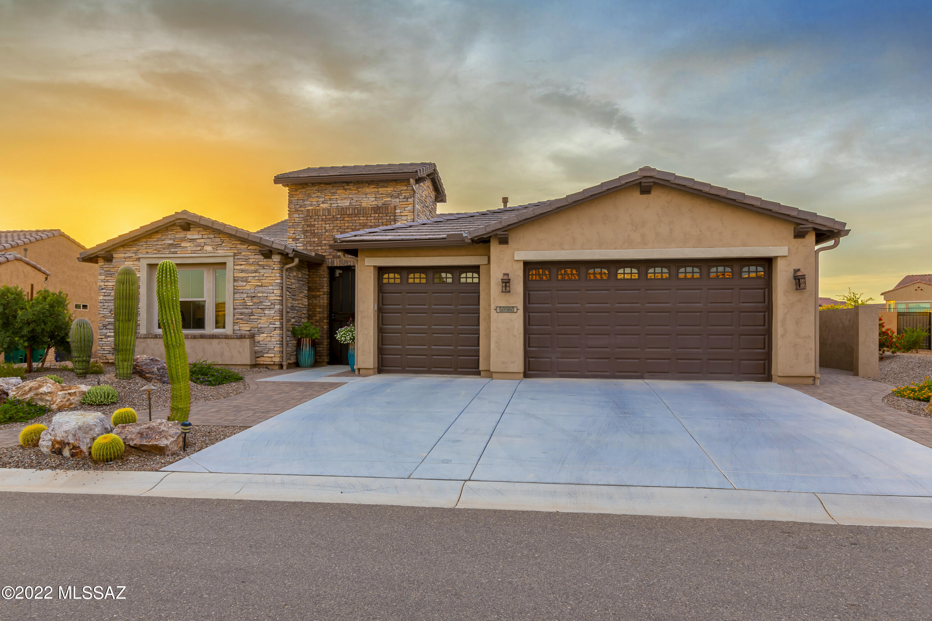 Exquisite home in the desired gated neighborhood SaddleBrooke Ranch. Welcome home to luxury living in this exquisite Vienta model loaded with upgrades. This open floor plan features many special touches including upgraded white cabinetry, designer light fixtures, ceiling fans and so much more.  Flooring consists of wood look tile throughout the main areas of the home and upgraded carpet in the bedrooms.  
Cooking is a chef's delight in this elegantly appointed gourmet kitchen that features a generous center island, roll-out drawers, built-in spice cabinet, GE Monogram stainless steel appliances and plenty of storage including a large walk-in pantry. 
Spacious Owners suite offers a luxurious bath with spacious walk-in shower, and a large closet with custom designed organizers. The oversized den with custom built-in cabinetry is ideal for your home office, separate TV room or library. 
Experience the wonder of this glorious backyard oasis featuring a covered built-in barbeque island, rolling shutters, oversized patio, and a soothing water feature, making this an entertainers' paradise.    
This is your opportunity to own a beautiful custom designed home in the Ranch without the wait!
