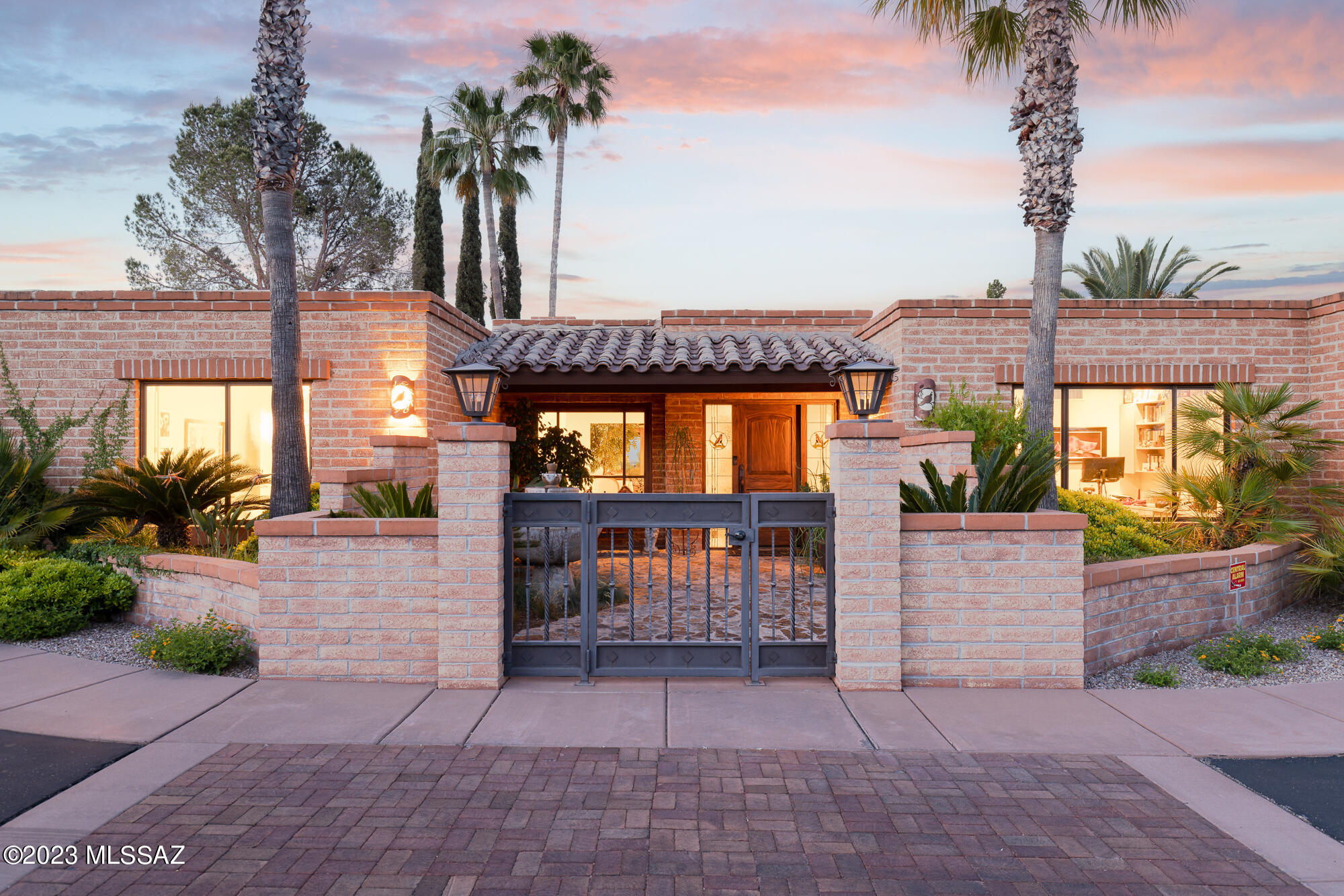 Perched atop a gentle hillside in Catalina Foothills Estates No. 9, this Territorial Style gem is graced with epic sunsets, views of the city, solace, and relaxation – just as its namesake Solaz would suggest. With 3,717 Sq Ft and 4 bedrooms & 3 bathrooms, the single level, split floor plan offers generous space yet private comfort & luxury. Sitting clandestinely on over one acre in the Catalina Foothills, the panoramic views of the city and sunset envelop the outdoor spaces. The well-manicured private backyard is surrounded by serene desert landscape & features resort-style amenities that provide perfect relaxation & entertainment options: solar heated pool & spa, putting green, built-in BBQ, private patios & dining space under the large, covered patio. The primary suite is positioned with direct access to a private patio and is its own large retreat with over 250 Sq Ft of space and a spa-like ensuite primary bathroom and large walk-in closet. Attached to the primary suite, is a versatile space that could be an exercise room, office or converted to a large 2nd closet.

An additional guest bedroom sits on the opposite side of the home, creating a secluded guest wing with an ensuite bathroom and direct access to the backyard.

Views of the Santa Catalina Mountain are prominent from the well-appointed office with built-in cabinets and bookshelves, while the temperature-controlled flexible work/craft/office/hobby room adjacent to the 3rd car garage provides over 235 Sq Ft of adaptable space.

The kitchen and family room are well thought out for both entertainment and intimate family gatherings. High-end appliances complement the cook's kitchen with character and thoughtful details throughout.

The home has a phenomenal location with District 16 schools, proximity to La Encantada and Joesler Village, La Paloma Country Club and direct access to downtown and Oro Valley. Countless details and character throughout with a high level of maintenance. 3-car garage with additional storage and large driveway with guest parking spaces.

Owned solar, 2019 HVAC's, and propane gas service to the fireplace and the range are considerable upgrades and provide efficiency.

10 reasons why it is great to live in the Catalina Foothills:

1. Natural Beauty: The Catalina Foothills is nestled against the stunning Santa Catalina Mountains, offering breathtaking views and a picturesque setting. Residents can enjoy the rugged desert landscape, with its distinctive saguaro cacti, diverse wildlife, and miles of hiking trails.

2. Pleasant Climate: The region benefits from a warm desert climate, characterized by mild winters and hot summers. The Catalina Foothills enjoy approximately 350 days of sunshine each year, making it ideal for outdoor activities like golfing, biking, and hiking.

3. High-Quality Living: The Catalina Foothills is known for its upscale residential neighborhoods, boasting luxurious homes, gated communities, and beautiful desert estates. The area is renowned for its high standard of living, offering residents a comfortable and prestigious lifestyle.

4. Excellent Education: The Catalina Foothills School District is highly regarded for its top-rated public schools, known for their academic excellence and comprehensive programs. Families with children can benefit from the exceptional educational opportunities available in the area.

5. Outdoor Recreation: The Catalina Foothills provides abundant opportunities for outdoor recreation. Residents can explore Sabino Canyon, a popular destination for hiking, picnicking, and enjoying the natural beauty of the Sonoran Desert. The nearby Coronado National Forest also offers various recreational activities, such as camping, fishing, and wildlife viewing.

6. Cultural Attractions: The Catalina Foothills is located just a short drive away from the vibrant city of Tucson, which offers a rich cultural scene. Residents can enjoy diverse dining options, world-class museums, art galleries, theaters, music festivals, and other cultural events.

7. Health and Wellness: The Catalina Foothills is home to several prestigious resorts and spas that offer luxurious wellness retreats and rejuvenating experiences. Additionally, the region has access to quality healthcare facilities and medical services.

8. Proximity to Amenities: While living in the Catalina Foothills provides a sense of serenity and seclusion, it is still conveniently located near essential amenities. Residents have easy access to shopping centers, grocery stores, restaurants, entertainment venues, and other necessary services.

9. Golfing Paradise: Golf enthusiasts will find themselves in paradise in the Catalina Foothills. The area boasts numerous world-class golf courses, including La Paloma Country Club, Ventana Canyon Golf and Racquet Club, and the Omni Tucson National Resort, offering stunning courses and scenic views.

10. Community Spirit: The Catalina Foothills fosters a strong sense of community and neighborly camaraderie. Residents often engage in community events, social activities, and local organizations, creating a warm and welcoming atmosphere.

These factors contribute to the overall appeal of living in the Catalina Foothills, making it an excellent choice for those seeking a beautiful, upscale, and active desert lifestyle.