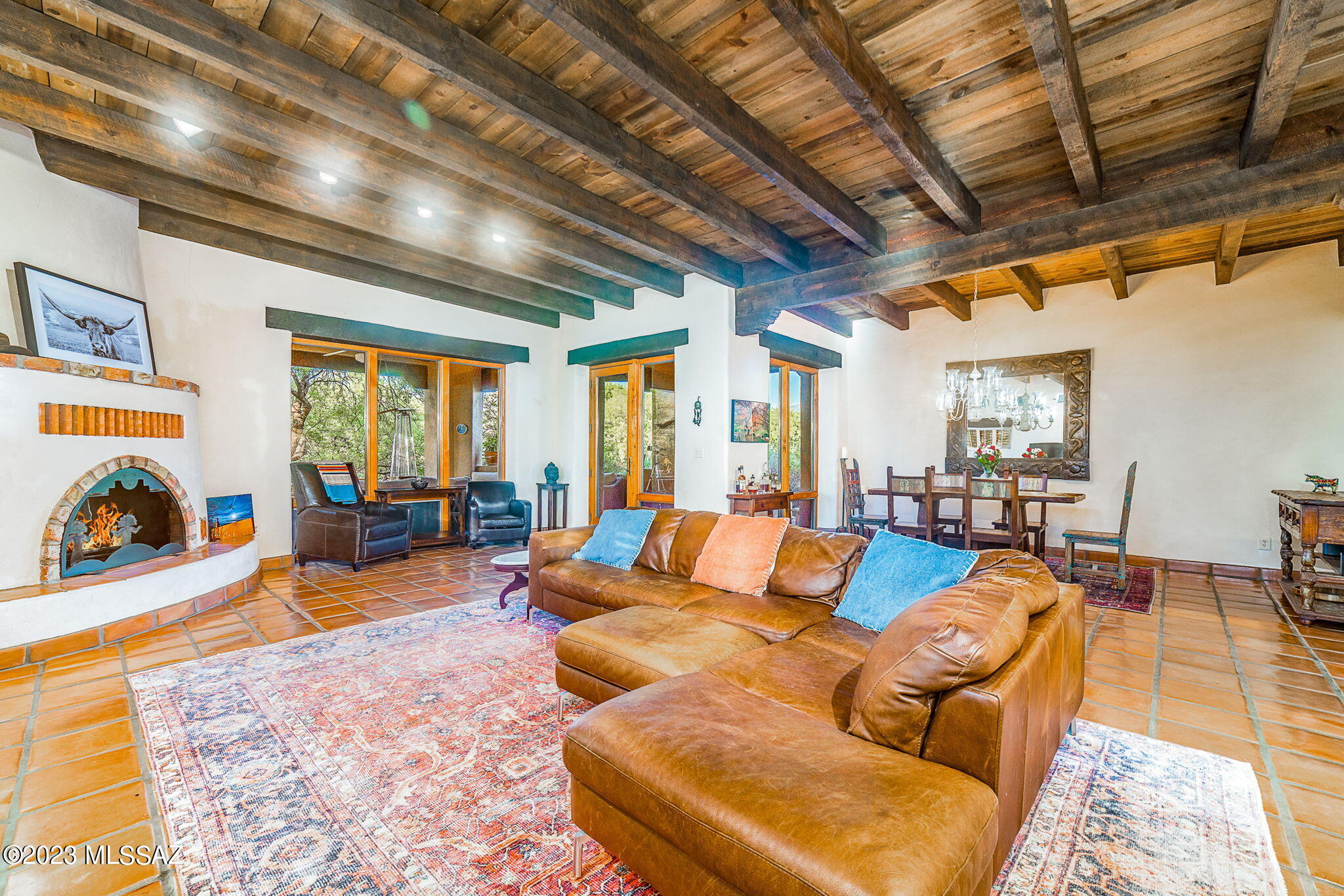 $10,000 in SELLERS CONCESSIONS! Charming Southwest Adobe home nestled on 2.6 acres in the Tanque Verde Valley. Enter through landscaped courtyard w/separate entrances to Guest
Wing, Garage & Main home. Great Room offers captivating mountain views, beehive fireplace, wood plank ceilings & adjoining dining area. An Inviting back
porch is located off the Great Room. Kitchen features large island, separate eating area, Brand New Sub Zero Refrigerator. Master bedroom w/sitting area & outdoor patio, 2 additional bedrooms & large bath are part of the main house. A separate guest wing contains 2 bedrooms & a bath along w/a separate HVAC system.  Large backyard to the side that has been grated for a pool with new fence.