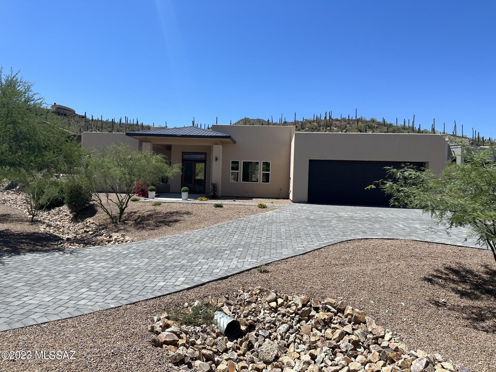 Awesome Contemporary New Construction,, located in a Prime area, corner lot, spacious;  this house boast  architectural design, Great Room with beautiful stone accented gas fireplace, plenty of windows, desert views, modern kitchen with waterfall style island, custom made cabinets with quartz, spacious master bath.  Modern Fireplace is gas with remote control  to gather in cold months.. This house is perfect for everyone and those  looking for comfortable and luxurious living experience.
This house is professional  virtually staged., A privacy window film was installed @ Master Bath and Bedroom door 
Irrigation and more front landscape  has been completed.
Come and see it.