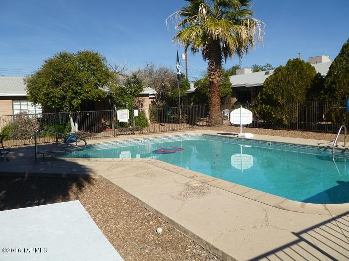 2 triplexes all 2 bedroom and 1 bath.  and a 5 bedroom house surrounding a pool and inside a walled area.   next to the UMC and a few blocks from the University of Arizona campus