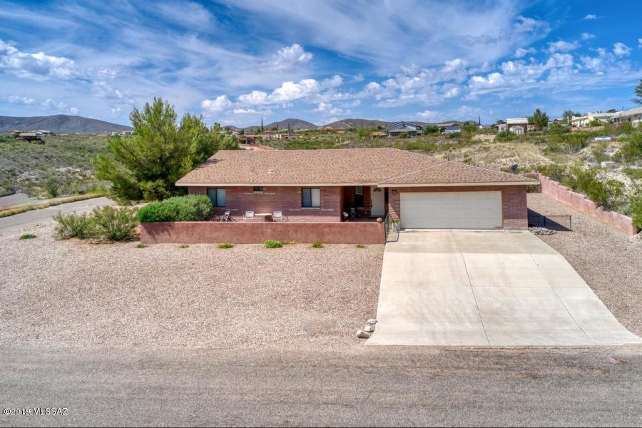 Own your own piece of the Historic WILD WILD WEST community of Tombstone. You'll love this GORGEOUS 2491sf 3bd 2ba on 1AC.
Spacious great room floorpan with all the right touches. Beautiful tile flooring in all the right places. Large kitchen with a huge island/breakfast bar perfect for the
culinary enthusiast plus tons of counter and cabinet space. HUMONGOUS master bedroom suite with a walk in closet the size of a bedroom! Large master bath with
dual sinks and a large walk in shower. Oversized 2.5 car garage. Wonderful front court yard to enjoy an AMAZING SCENIC & MOUNTAIN VIEW and large back patio
where you will enjoy our excellent year round Arizona weather. A MUST SEE HOME!