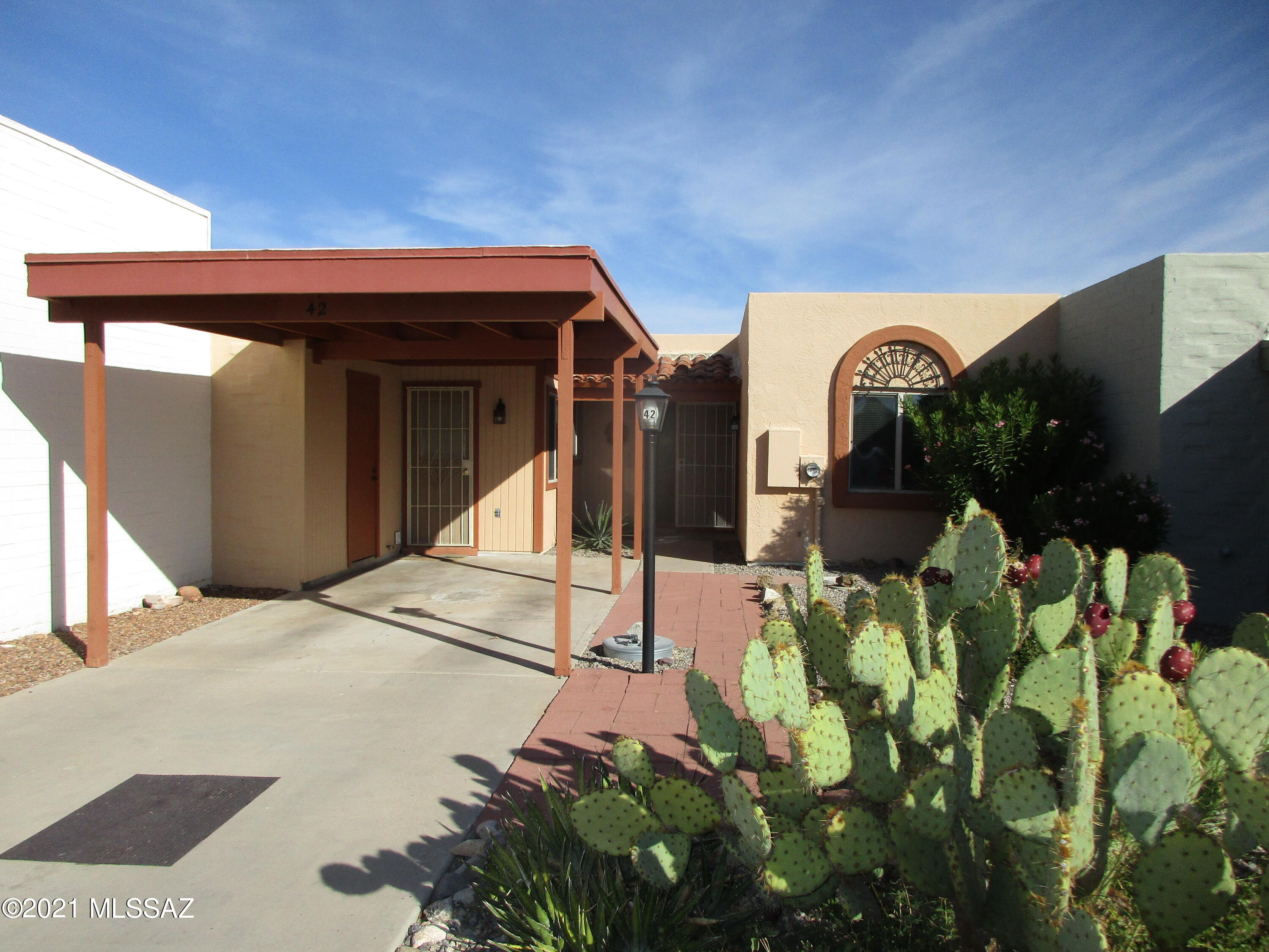 Well priced 2B/2B home. Purchased in 2014 with new appliances, seller has added many new updates to the home. New windows in the front of the house added in 2014. Exterior painted in 2014. All new floor tile installed in 2020, new kitchen backsplash in 2020 and new toilets in 2021. New hot water heater in 2018. New slate tile to front and back patio in 2019.  New roof coat in 2021. Interior painted in 2020. New outdoor lighting in front in 2021. Owner has added countertop to create a built in desk/bar in the kitchen. Subdivision has its own GVR pool and clubhouse, too. Home has two outside storage closets in the front and the back. Owner is licensed Arizona real estate agent.