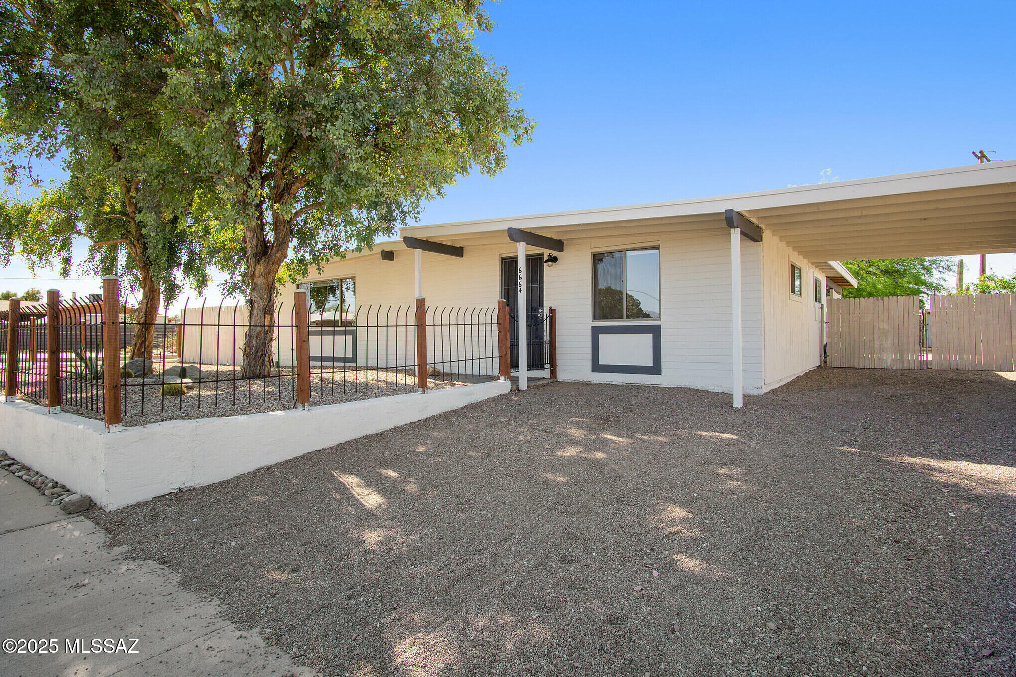 Step into your own private retreat with this 4 bed 2 bath home! The home is open and inviting featuring an updated kitchen with stainless steel appliances and plenty of counter space,  fresh tile and LVP flooring throughout, large bedrooms with ample closet space, and remodeled bathrooms.  The backyard is open and spacious, perfect for relaxing or entertaining under the desert sky.  All around, the home personifies Tucson living with its desert landscaping and cozy southwestern vibes. Close to shops, restaurants,  Reid Park, and local golf, this home will keep you close to all that Tucson has to offer.