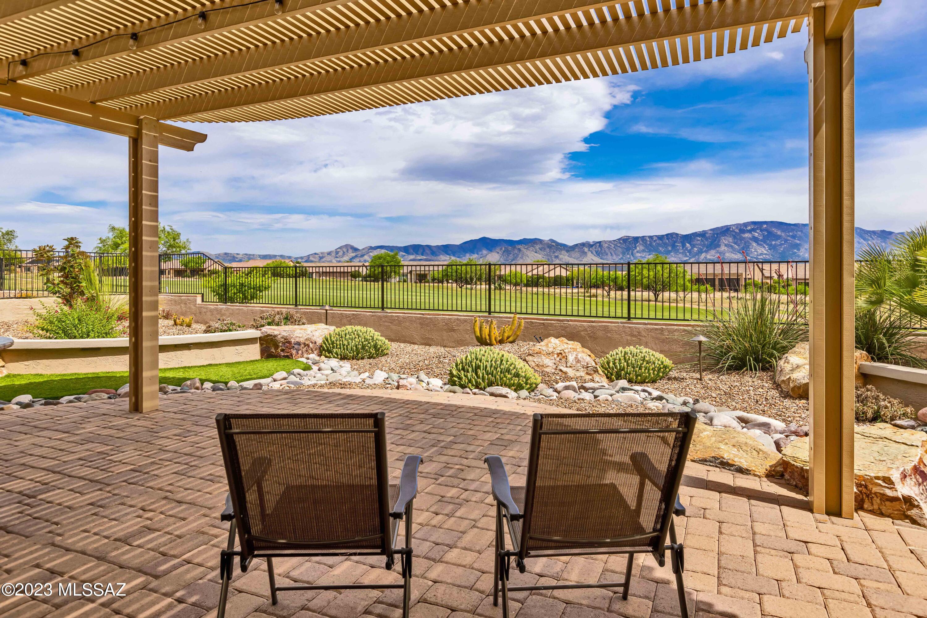 Panoramic mountain views over the lush golf course fairway await in this highly upgraded Pima model w/attached casita.  Relax in the shade of the pergola on the extended patio complete w/built in BBQ & gas fireplace, a perfect place for entertaining.  Inside this 3 bedroom, 3.5 bath home you'll find a well appointed kitchen w/generous island, induction cooktop, GE Advantium appliances, under cabinet lighting, granite countertop, beautifully detailed cabinets w/premium crown moulding, base cabinet pull outs & pull out trash receptacles, corner lazy susan, & pantry closet.  Beautiful, easy care LVP floors throughout.  Full vanities in all bathrooms.  Solar tubes, plantation shutters, H2O Water concepts purifier w/recirculating pump.  Premium washer/dryer, 2.5 car garage.  Why build new??!