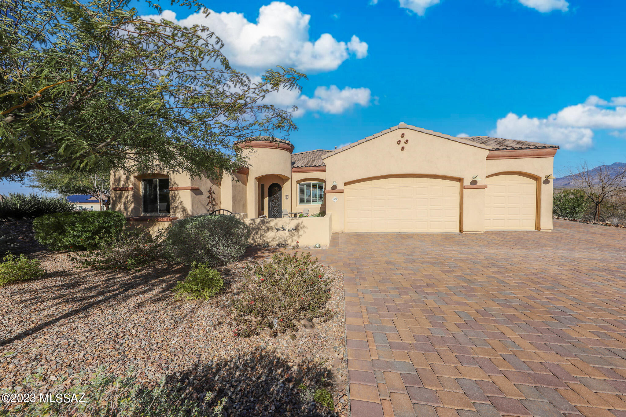 Solar Owned!! Less than 15 min. drive to Raytheon & shopping. Many custom upgrades in this must see well cared for home in the much sought after Vail School Dist. Level paver driveway with 5400 sqft total throughout property. Extended covered patio with solar screen. Majestic 360 mountain views on corner lot w/no one behind you. Full RV hookup with plenty of space for any length. Rhino Shield exterior paint with 25-year warranty. Bocce Ball court in this meticulously maintained backyard with your very own mini desert botanical garden. All plants on a drip system including fruit trees, 8 saguaros and many rare cacti. Beautiful 8' arched wrought iron front door. Whole home water filtration system, hot water on demand & reverse osmosis in kitchen, and tankless water heater. 30' flagpole from the 1984 Summer Olympics that was given by Frank Borman (Astronaut). Oversized front bedroom. Custom large laundry room. Gas hookup outside with firepit and grill. All tile except 2 rooms. Plus a large den/office with double doors. All appliances included.