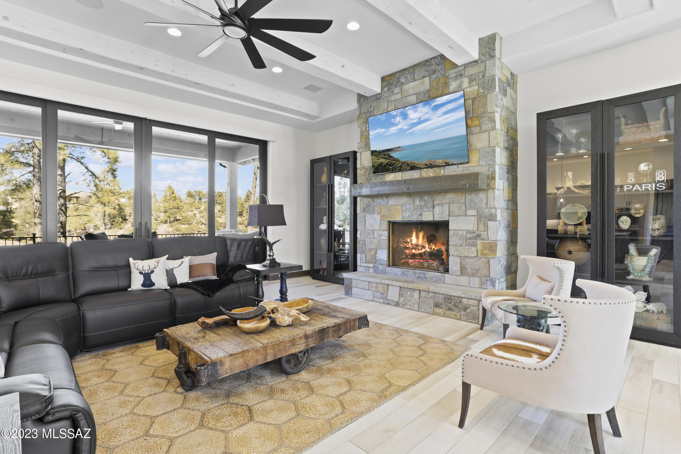 This custom home is located in the highly desired golf community of Chaparral Pines. Enjoy beautiful sunsets on your expansive deck, or head down to a waterfront seating area complete with a fire pit and room for all! Inside you will find yourself surrounded by top-of-the-line finished and upgrades. This kitchen is complete with Wolf appliances and match quartz backsplash and counters. Beautiful custom chevron floors will take you to 2 stunning on-suite bedrooms, a dedicated office space, a bonus room currently being used as a theater, and a primary bedroom you have been dreaming of! This estate is a rare find with a 4 car garage to fit all your toys. Schedule your private showing today to learn about the incredible upgrades and experience luxury living in Rim Country!