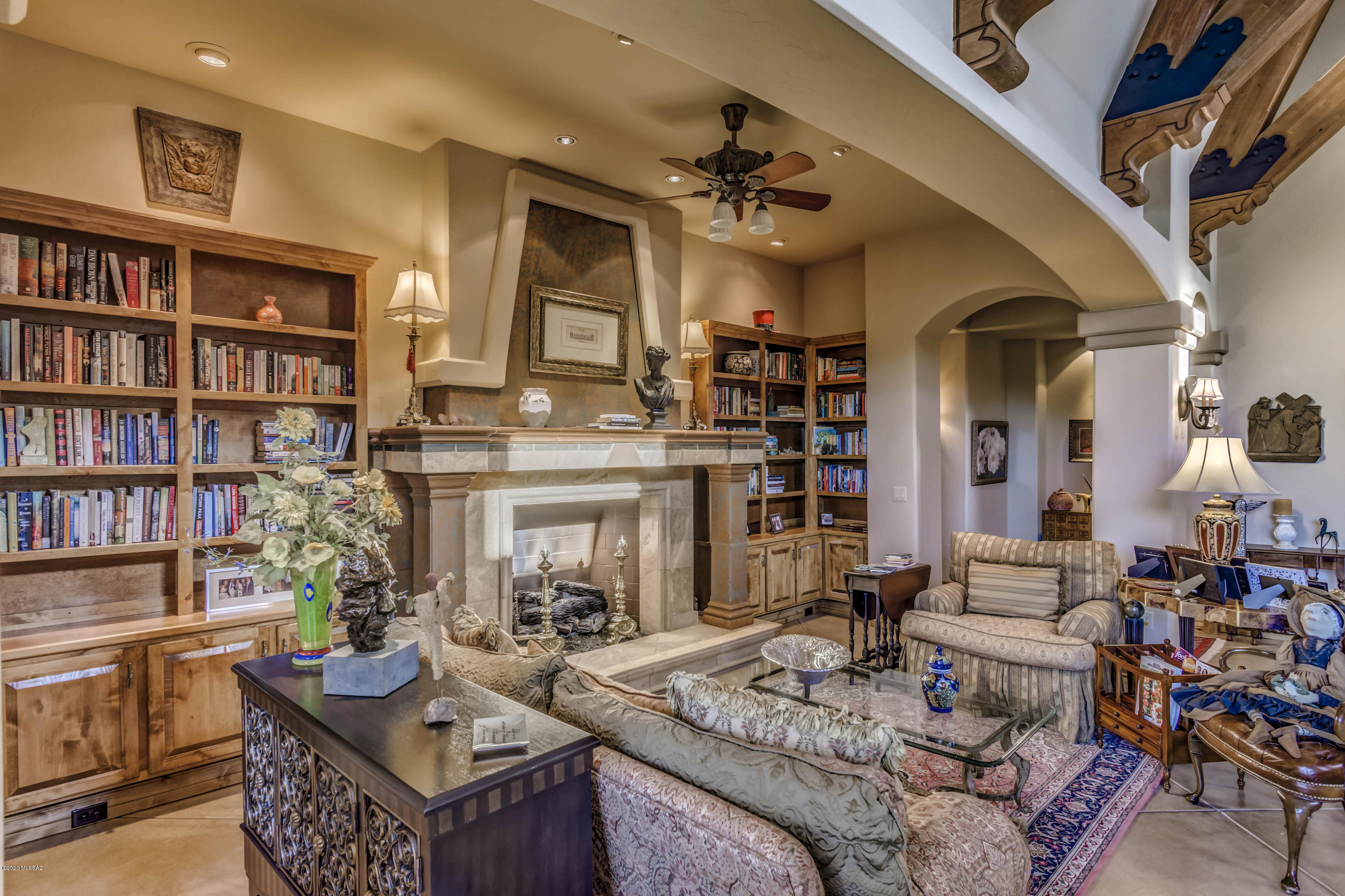 Stunning Executive Estate nestled in the heart of the Catalina Foothills with expansive views of the Catalina mountain range. Massive hand hewn wood beams in the open living room. European flair with Heartland appliances in the kitchen, butlers kitchen, wine fridge, and custom bar in the family room. Enjoy the opulent master bedroom with his and her closets and imported fireplace from Italy. Three other ensuite bedrooms with outdoor patio accesses. Gorgeous one bedroom guest house with full kitchen and dedicated access. Sit or entertain on the oversized patio with outside bar and massive fireplace, or relax in the spool and enjoy the views. The house is all on one level. Master washer/dryer, and also laundry room in the home and a finished four car garage with hobby and utility room.