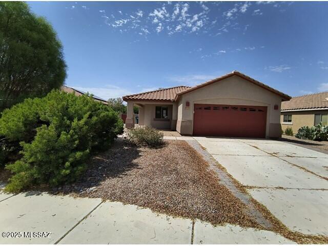 Single-story home featuring 3 bedrooms, 2 bathrooms, and an open layout. The property includes a two-car garage and a fully fenced backyard. Built in 2005, it remains in fair condition with some dated finishes and signs of deferred maintenance. Located near major roadways including I-10, with nearby access to retail stores, parks, and the Gladden Farms community amenities. Local points of interest include Tucson Premium Outlets, Marana Library, and area schools and healthcare facilities.