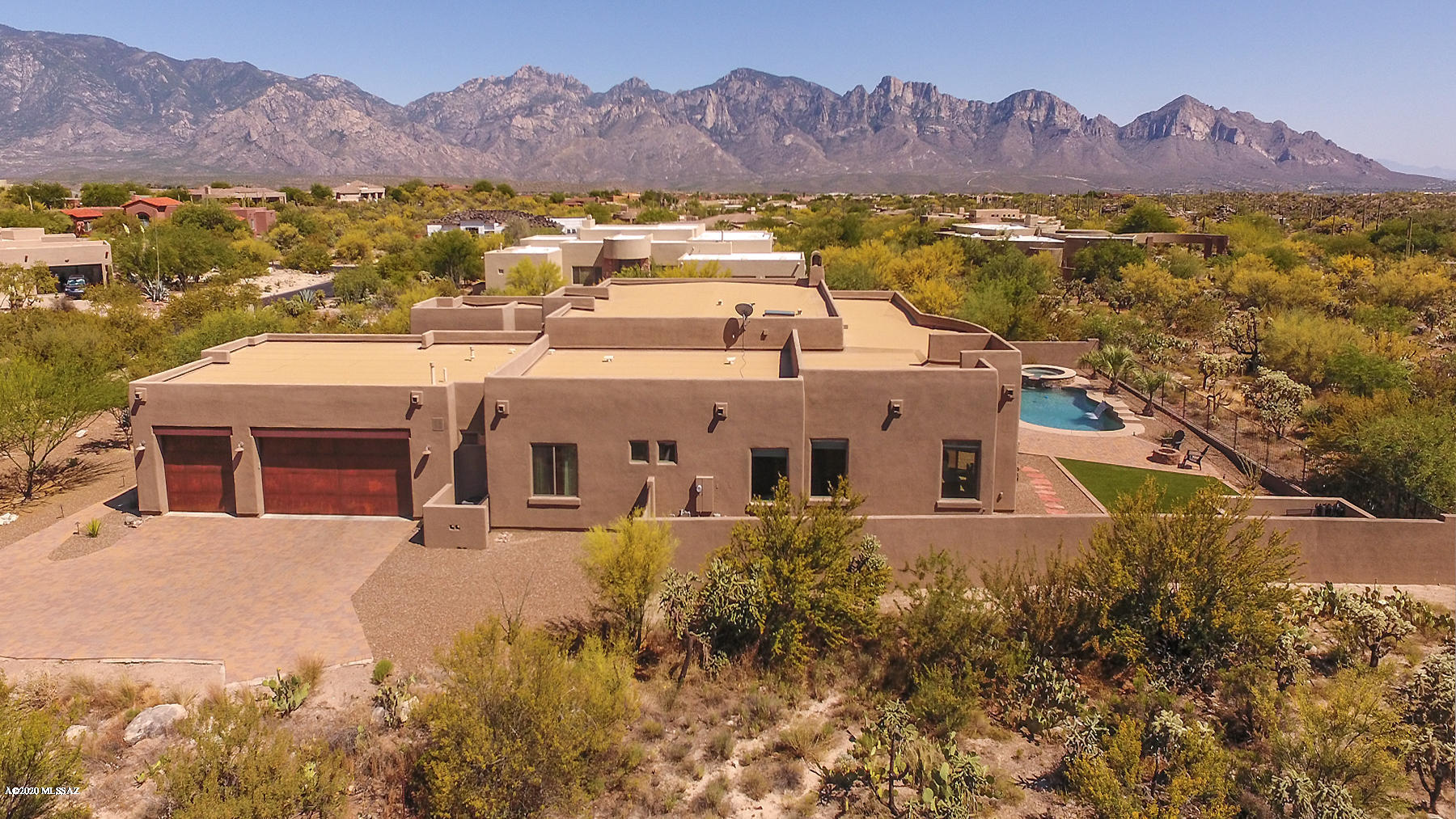 Timeless elegance awaits at this 4BR/5BA (4,334 sqft) luxury Contemporary with multiple living/dining options and resort worthy yard w/majestic mountain views. Situated on a private cul-de-sac lot in guard gated Honey Bee Ridge Estates. Front courtyard leads to an open concept floor plan w/soaring exposed beam ceiling, Travertine tile, floor-to-ceiling stone fireplace, over-sized windows and a family/media room. Stunning Chef's kitchen boasts a breakfast nook, granite counter-tops, breakfast bar & luxury appliances. Elegant Dining Room and Library showcase hardwood floors and coffered ceilings. Retire to the luxurious Master suite hosting dual walk-in closets, jetted tub and pebble rock shower. Fabulous outdoor living with heated saltwater pool/spa, fire pit, play area and views!