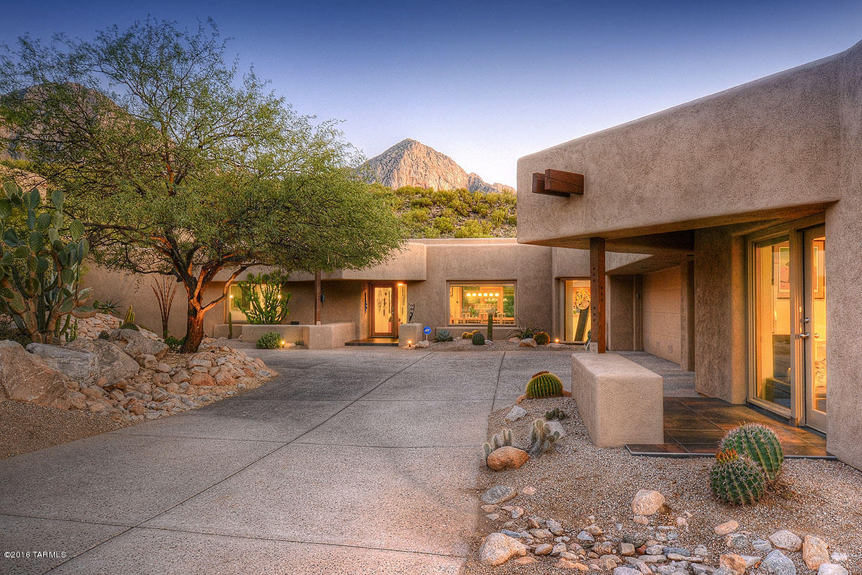 Awesome vistas and privacy from this artistic contemporary home with guest quarters in Wilderness Estates II. This home features clean lines, high ceilings and floor to ceiling windows. True open floor plan with a great room, gallery/library, and kitchen open to family room with fireplace. Luxurious master suite with huge walk-in closet, fire place & large soaking tub. Casita is located off of the 3 car garage, includes desk area, wall beds and full bath.  Fabulous patio for entertaining with BBQ area, negative edge pool and spa. Relax and enjoy the stunning views of the many acres of open space.