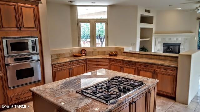 Inside gated Ventana CC, Whaleback Ridge Estates home. Over 4057 SF, 5-Bedrooms, very spacious Master Suite with 2-way FP, 4 Baths, dramatic entry Foyer and sunken Living Room, Formal Dining Room, additional FP in Living and Family rooms, Big kitchen for entertaining ease (granite tops, of course!), all appliances included, loads of storage with roomy closets and separate storage rooms in 3-car garage. Travertine floors, very private patios, large rock water feature, outdoor kitchen, and added spa tub outside Master bedroom wing.
Simply a Beautiful home- Ready for you right now!