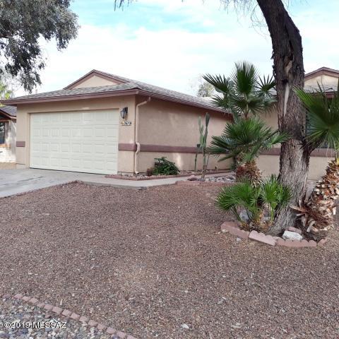 Spacious 3BD/2BA home w/split floor plan. Open kitchen w/bay window, convenient door to back yard. Spacious family rm w/fireplace. Has 2 car garage & work bench, irrigation system for plants in the back yard w/established trees in both the front & back yards. This home has a 3 year old roof & upgraded ceramic tile throughout the house. Utility room w/washer & dryer that will stay in the home. Located in the best area in the subdivision across the street from park that has a Ramada, BBQ pit, playground, baseball diamonds & a basketball court. It gets better! This home is one house away from the community pool & spa that offers three Ramada's, BBQ pits w/ample parking to accommodate lasting memories for your family events. Poly Just changed out, new carpet and fully remodeled. MOVE IN READY!