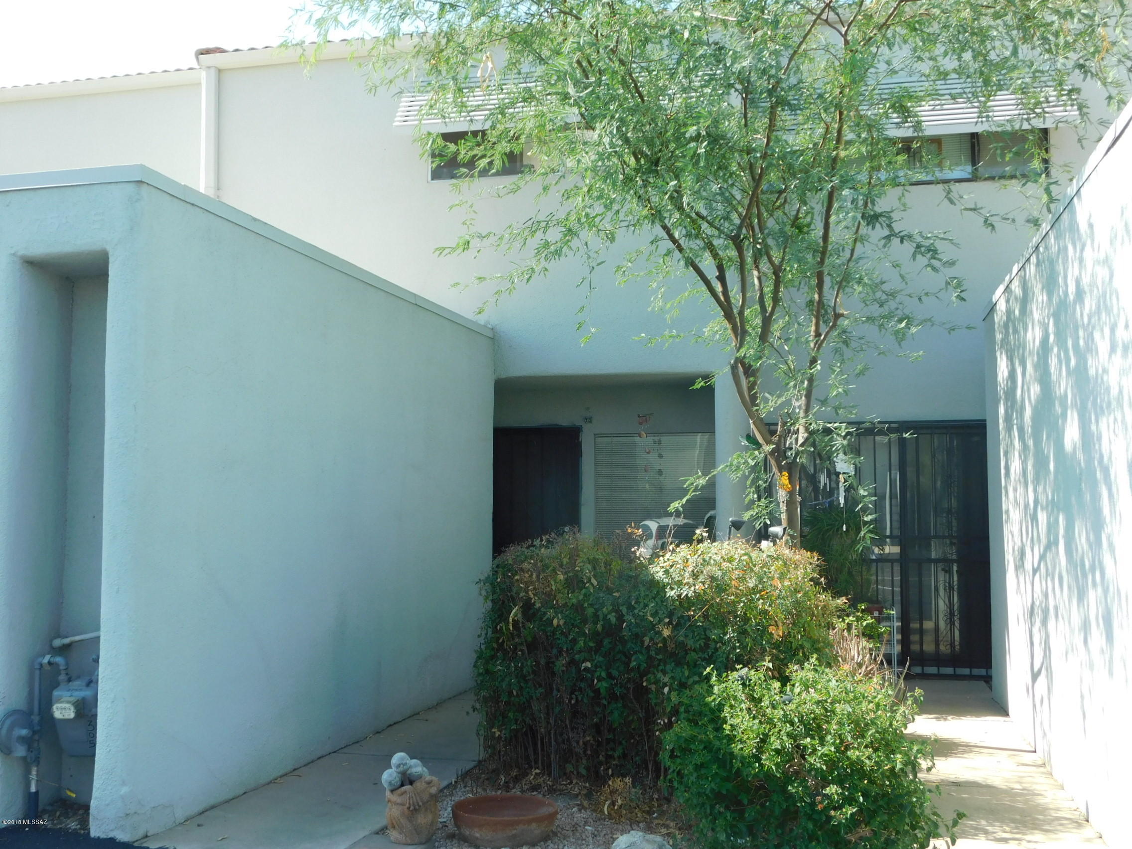 Perfect townhouse located just far enough out of town to be peaceful, yet close to anything you could possibly need. After parking in your own carport and walking in through the front door, you are greeted with a very light and bright dining room and kitchen. Or you can enter straight into the kitchen, which makes bringing groceries in super convenient. Main floor has an updated half bath and spacious living room. Upstairs are two very large bedrooms and an updated bathroom. The master bedroom has vaulted ceilings and two closets. The second bedroom has a walk-in closet. Outside is a private patio with mountain views! One of the two community pools is located just steps from the patio. Common area also includes BBQ grills, picnic tables, and even a tire swing.  Seller will pay 3k in CC! Ne