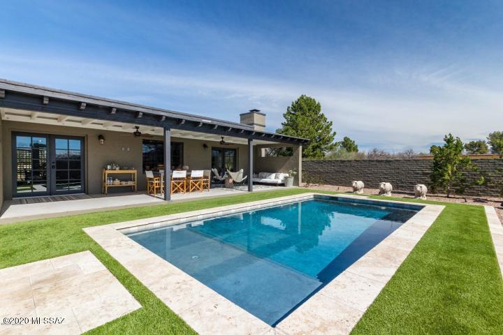 Completely remodeled in 2018, this home is nestled within the warm and welcoming community of Tubac Valley Vistas Estate – a literal stone's throw from the idyllic and renowned Tubac Golf Resort, yet minus steep HOA fees or property restrictions, this home is bound by the rugged Tumacacori Mountains to the West, and the equally majestic Santa Rita Mountains to the East, ensuring picturesque sunrises, sunsets, and possibly the most brilliant night skies, teeming with twinkling stars. You may kick yourself that you didn't consider moving to Tubac earlier. But you're looking now, so jump on this opportunity to secure a truly unique and charming home, low on maintenance and high on the happiness scale. Set on a fraction shy of an acre, the property includes a large circular driveway leading to a two-car garage, set on easy care front and side yard xeriscaping (native and drought-tolerant). The backyard is truly delightful and private with a high bricked wall, covered patio with dual ceiling fans, Bose outdoor speakers, pool and high-quality artificial turf and poolside travertine deck. 

A detached 'casita' with open plan laundry (no bathroom) and spacious closet has been utilised by former owners as a writer's/artist's studio. Install a drop-down Murphy bed for overnight guests or easily convert the existing space and existing laundry plumbing to a bathroom for a dedicated yet separate guest room, man cave/she shed or mud room/additional storage.