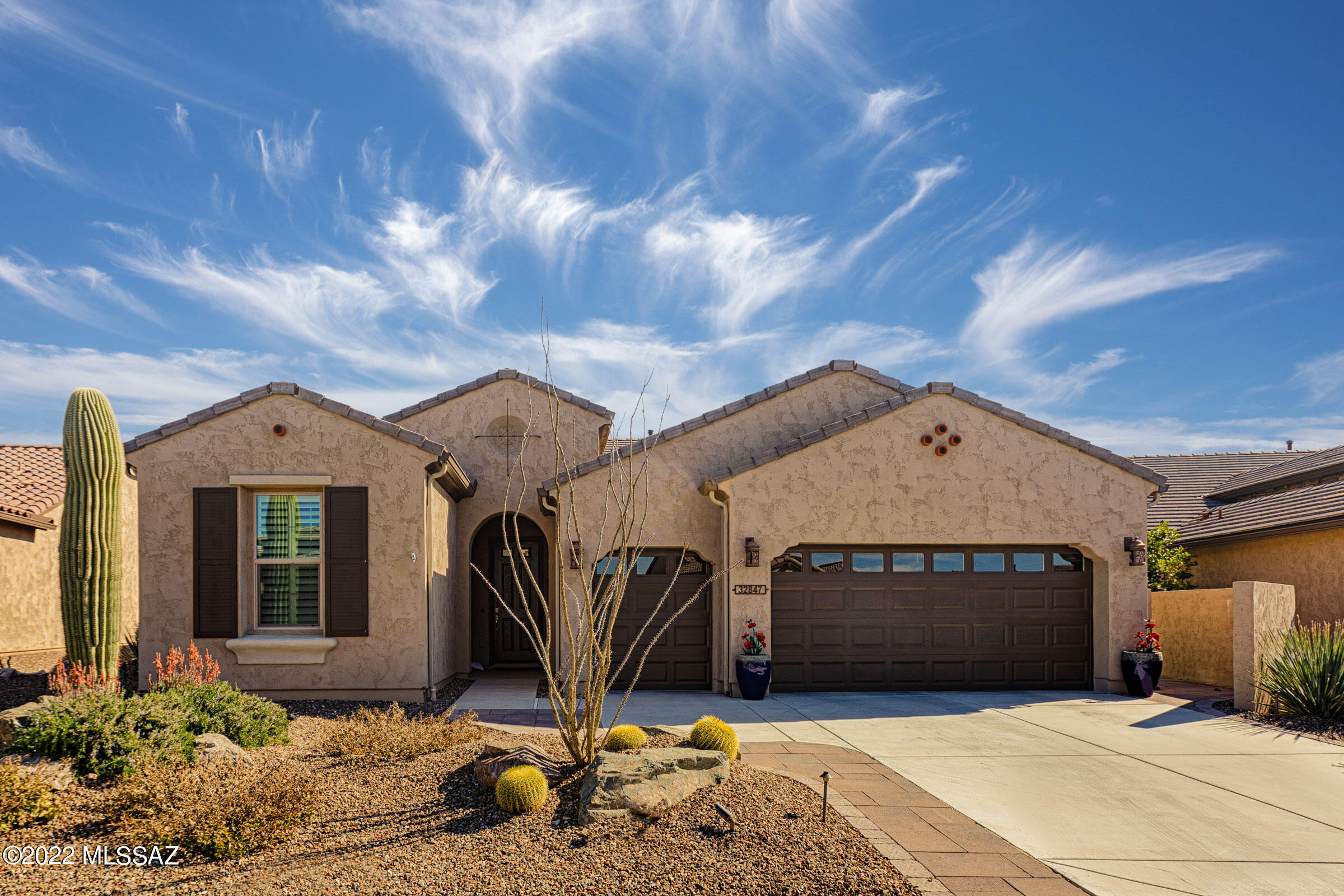 A popular expanded Fresco model at 2019 sq. ft. of perfect Southwest living with 2 bdrm Suites, 2 Baths and Powder Room.  Great Room is expanded and features a beautiful Entertainment Wall with Organic Accents.  High Ceilings give a feeling of spaciousness.  A separate Dining Area is an entertainers delight coupled with a generous Kitchen Island.  A Walk-In Pantry provides exceptional storage.  The Master Bdrm features a large Walk-In Closet; a large Master Bath with built-in Shower Seat; Bathroom Vanity with Make-Up Area.  A separate Laundry Room with Storage, stepping out into a Deep Two-Car Garage with Golf Cart Garage.  A large back yard is enhanced by 350 sq. ft. of Covered Outdoor Living Space with extended pavers and Organic Privacy Fence that creates your very own desert oasis. Partial views of Mt. Lemmon and the Catalinas top off the backyard for the perfect desert experience.