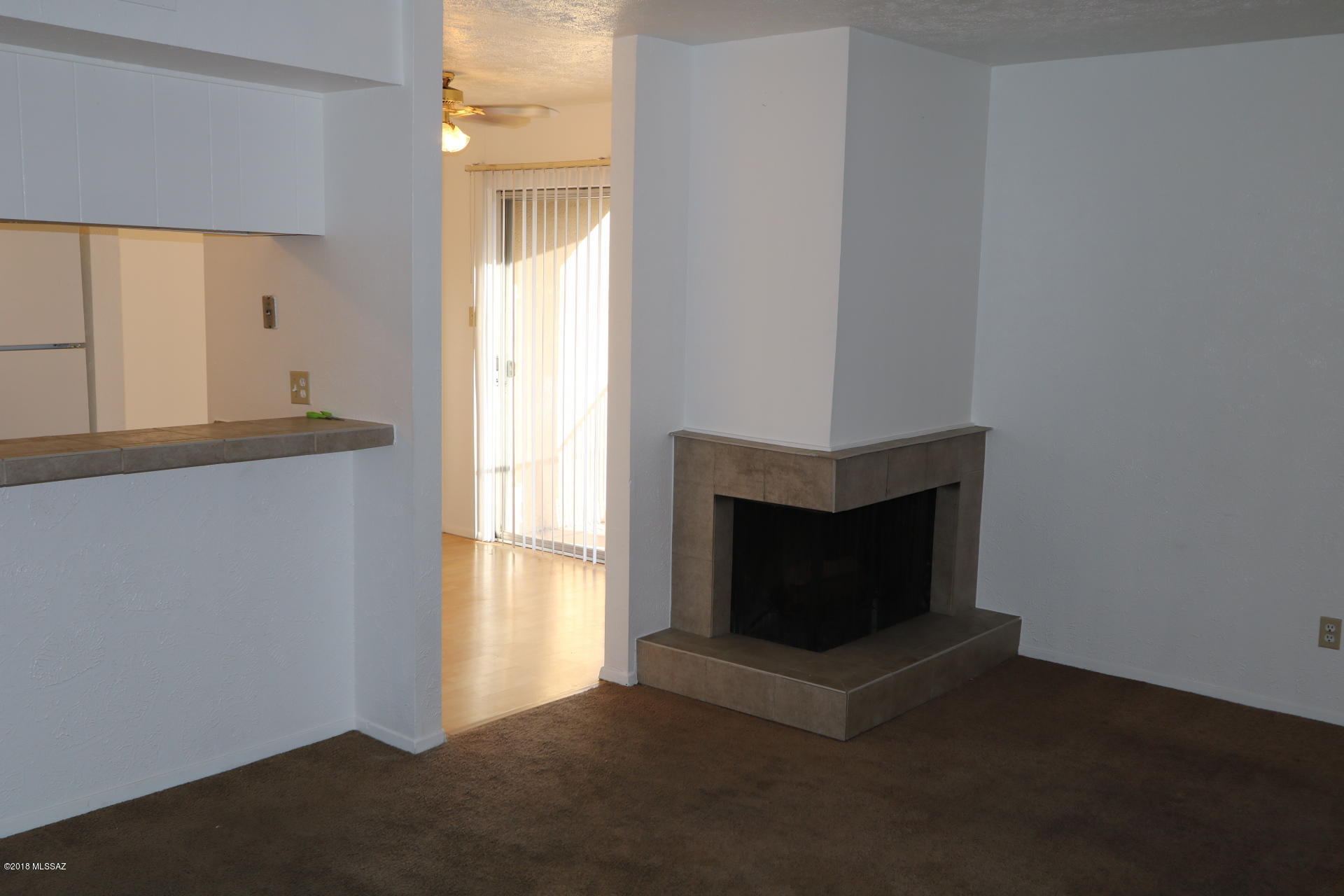 THIS UPSTAIRS UNIT HAS A VIEW AND A FIREPLACE AND BALCONY.  THIS UNIT IS ABOVE UNIT 163 ALSO FOR SALE SO A PERFECT CONDO FOR EXTENDED FAMILY LIVING OR EASY RENTAL RIGHT TOGETHER.  HOA MONTHLY IS $153 AND COVERS LANDSCAPING, WATER, THE ROOF, AND EXTERIOR MAINTENANCE AND POOL.  UNIT IS NEAR THE COVERED PARKING ON THE SOUTH SIDE OF THE BUILDING. THIS LOCATION IS NEAR BUS LINES, AND OTHER CONVENIENT SHOPPING.   CHECK OUT MLS # 21826124 FOR THE OTHER DOWNSTAIRS LISTING. PACKAGE SALE AN OPTION.