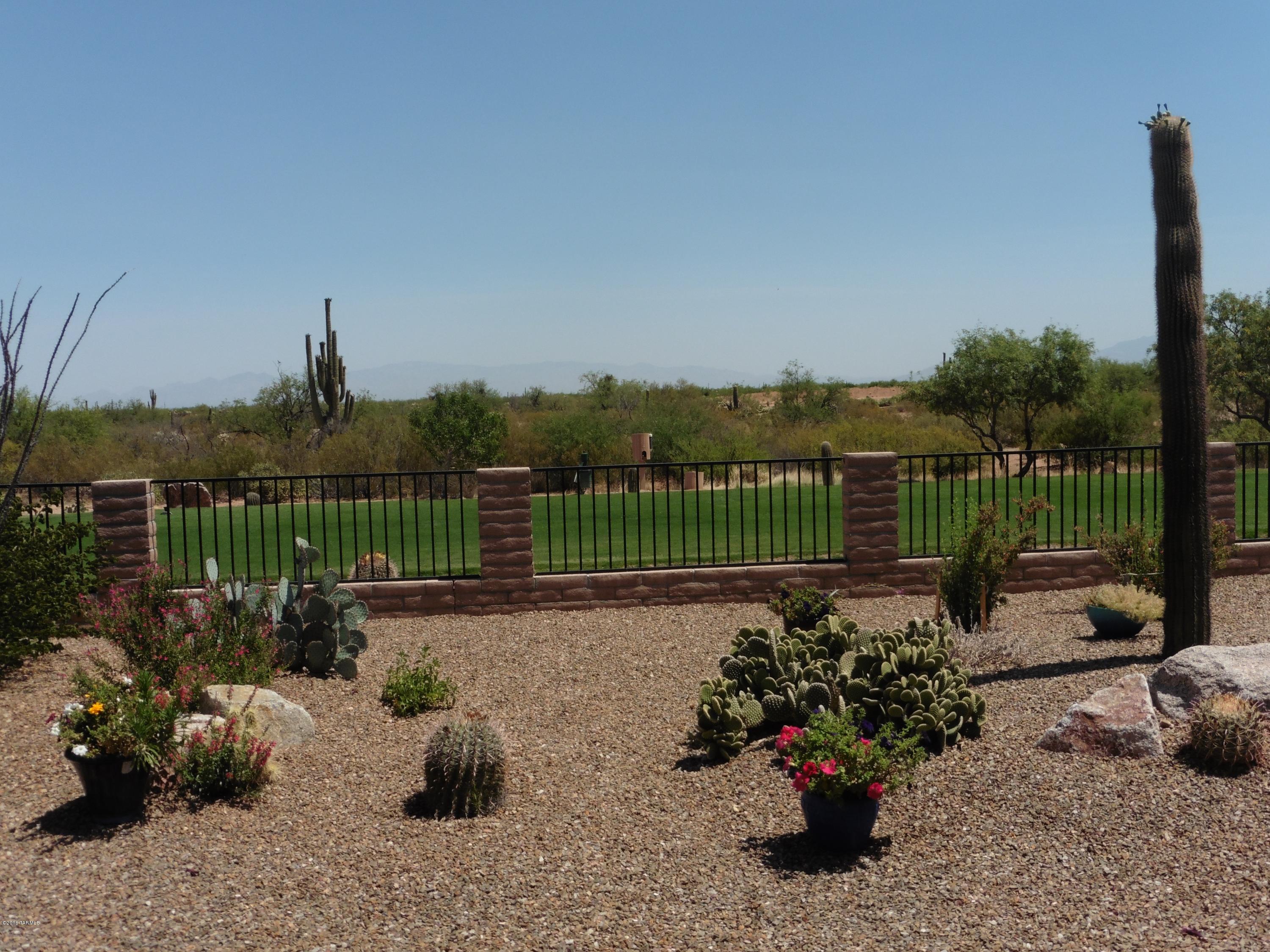 Located on Road Runner golf course (Men's 7 T-Box)this house has all the sought after features: Granite counter tops, breakfast bar island, pendulum light fixtures, & pantry closet. Your days will begin & end in this beautiful master suite featuring a walk-in closet, dual sink vanity, & bay window. Enjoy the privacy of the guest suite with walk-in closet. The living areas & master suite overlook the gorgeous landscaping with the golf course just beyond. Additional outstanding features include den, spacious covered patio, built-in grill, conveniently located within the community and large storage closet off the laundry room. Furniture available by separate bill of sale. ENERGY STAR CERTIFIED HOME! Leased solar system. SELLER WILL PREPAY UP TO 60 MONTHS OF THE SOLAR LEASE PAYMENTS.
