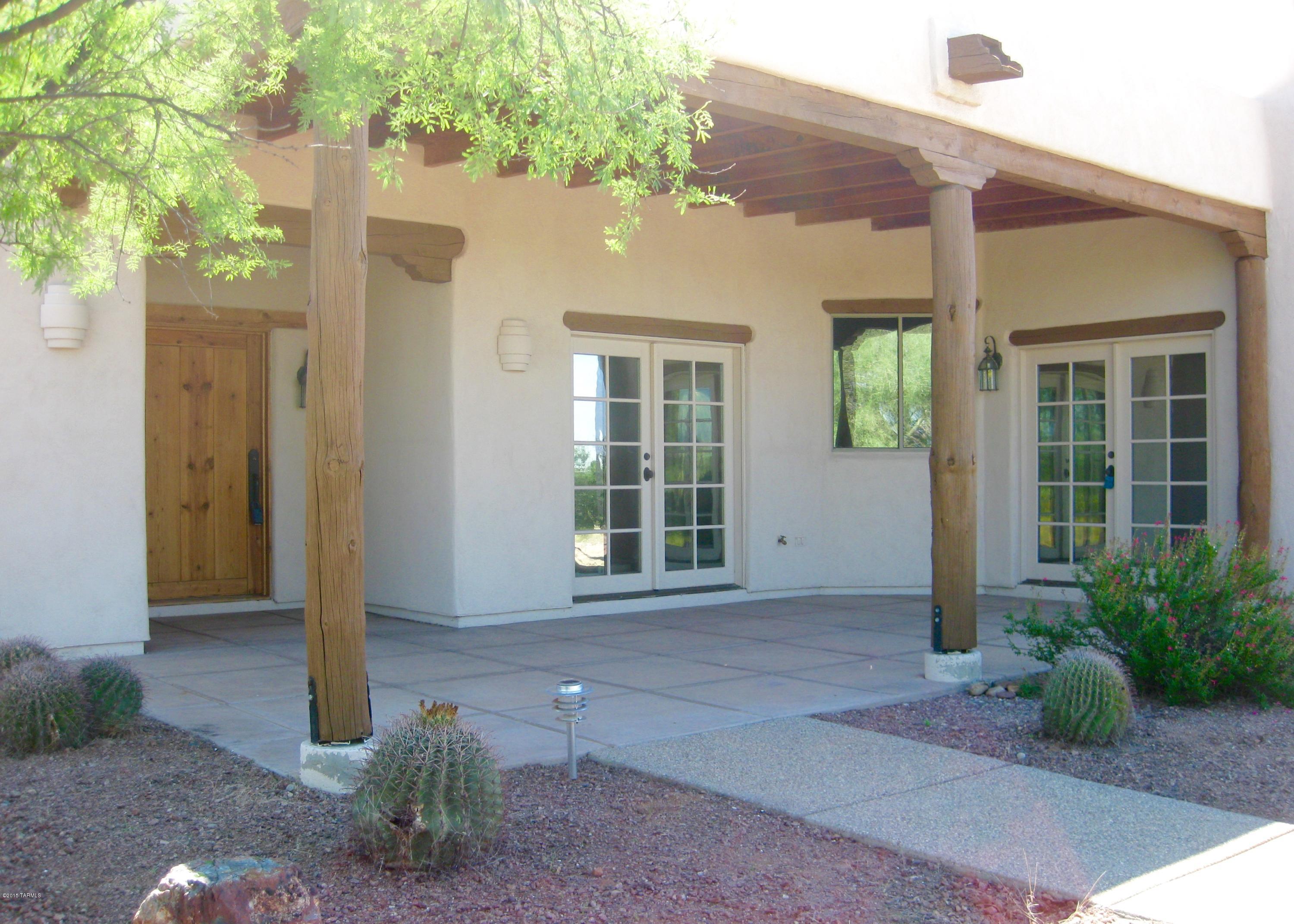 Lovely 4BR 3 Bath Southwestern Contemporary w/Mountain Views on 4+ acres in gated Sycamore Springs. Original owners included many upgrades, custom interior doors and hardware. Chef's kitchen with granite counters, gas cooktop, stainless appliances, reverse osmosis water filter system on island sink and 50 bottle refrigerated wine butler. High ceilings, Skylites and decorative niches throughout. Mocha scored concrete floors. Formal living Rm, Formal dining Rm, Gas fireplace in Family Rm off kitchen. 2 cedar closets. Master BR suite has multi jet walkin-shower, spa tub, dual sink vanity, walk-in closet. French doors open to gracious covered patios front & rear of house perfect for watching sunrise and sunsets. Top rated Vail Schools. Zoned gas heat/cooling and two hot water heaters.