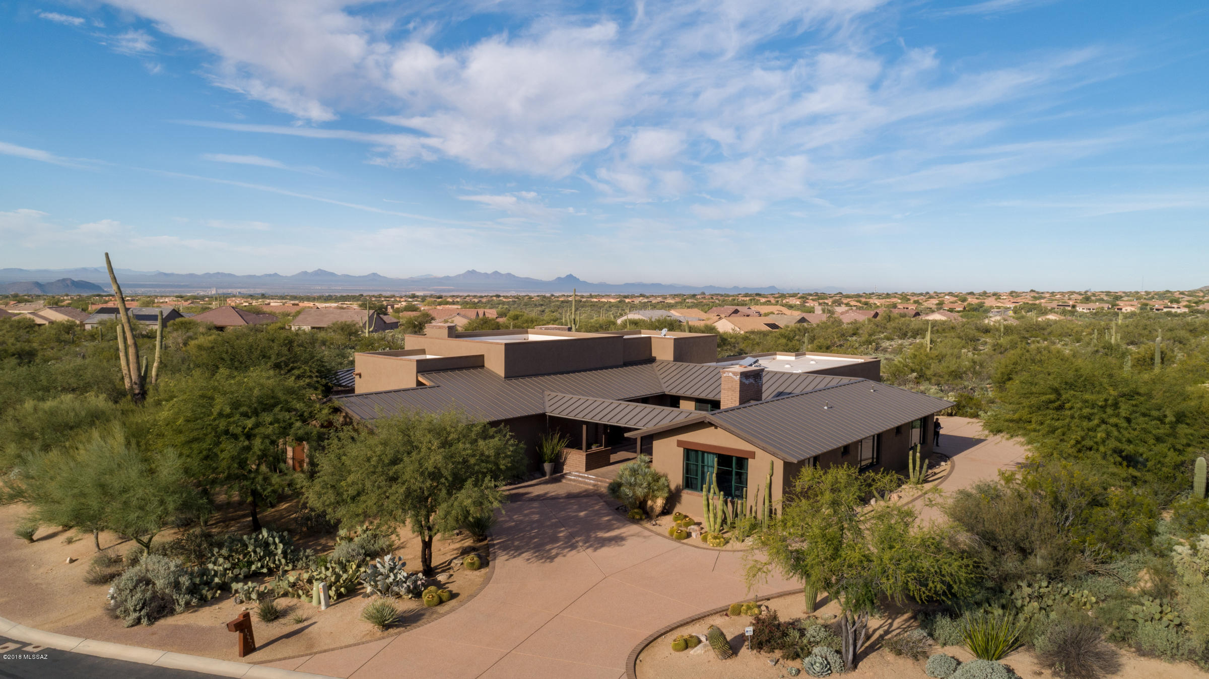 JUST REDUCED BY  $74,000 
Discover this captivating and unforgettable luxury home with majestic views of the Tortolita Mountains and beautiful Sonoran preserve. With so many amenities and features, this property is a must see. This award winning ''Parade of Homes'' model in a small and private gated community has four spacious bedrooms and 3.5 bathrooms.  Architecure Designed by Rob Robinette, this exquisite home has a Rustic Mountain Ranch feel with an Elegant Contemporary flare.  
You are welcomed by the private Entry Courtyard with glass rock fireplace that also provides access to the guest wing. Inside you will find an Amazing great room with soaring rustic beam ceilings , 3 authentic brick wood burning fireplaces with convenient gas option, Walls of glass/stackable doors, Earthy brick floors throughout, Slate/Limestone/Mosaic stone work, Grey concrete countertops, Custom Cedar DoorsGourmet kitchen with Viking appliances, Built in Cabinetry and More. 

You will love the outside of this property as well. It was voted "Best Outdoor Space" for its beautiful custom Pebble Tec pool and spa, spacious covered outdoor living space with a Great Room feel complete with Viking outdoor appliances and a Fireplace that are accompanied by striking views to the west and dramatic sunsets.

Please see the attached brochure document for a detailed list of all of the spectacular details for this Splendid home.
