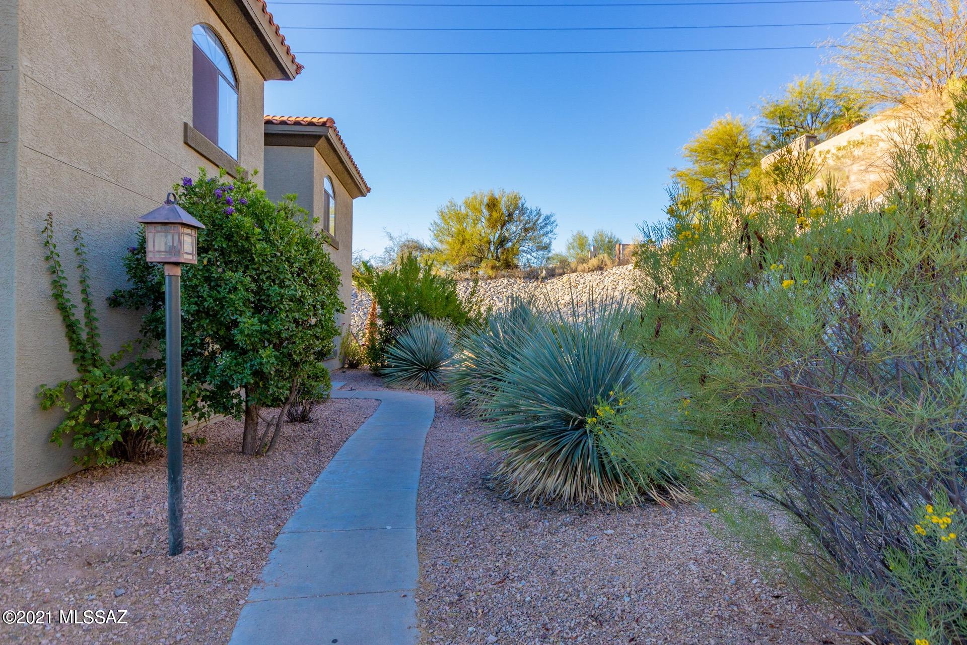 Breathtaking Mountain views! Welcome to the Gated Community of Veranda at Ventana Condominiums. Gorgeous Condo w/a warm & welcoming palette, plush carpet, ceiling fans, & French door to the private patio. Beautiful tile floors, stylish kitchen counters, breakfast bar, & plenty of wood cabinets. Dining area w/upgraded lighting. The master retreat offers patio access & a private en suite. Ample closets, interior laundry room, & 2 pristine baths.  Take a tour today & stop renting.