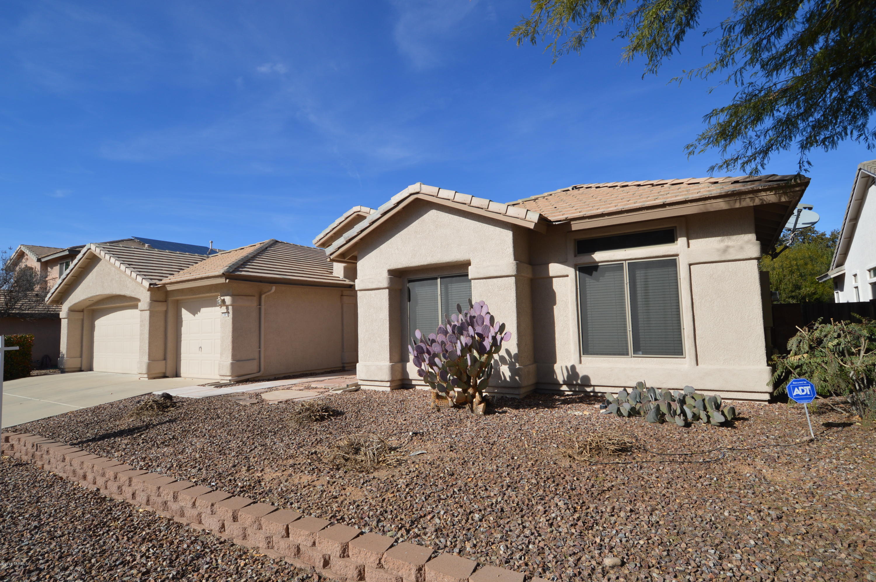 : Stunning one level executive home in highly desirable school district. Immaculate condition, soaring ceilings, granite counters, wood floors and designer paint. Huge master suite with luxuirous bath, walk-in closet. Gourmet kitchen with upgraded cabinetry and granite counters. Massive family room overlooking sparkling solar heated pool and above ground spa (pool service included). Low care landscaping perfects this desert oasis, and semi-annual trimming is included. The third stall of the garage has been converted to a bonus room, ideal for home office, craft room or studio. Small dogs considered! This sought after home wont last long, so CALL NOW!!