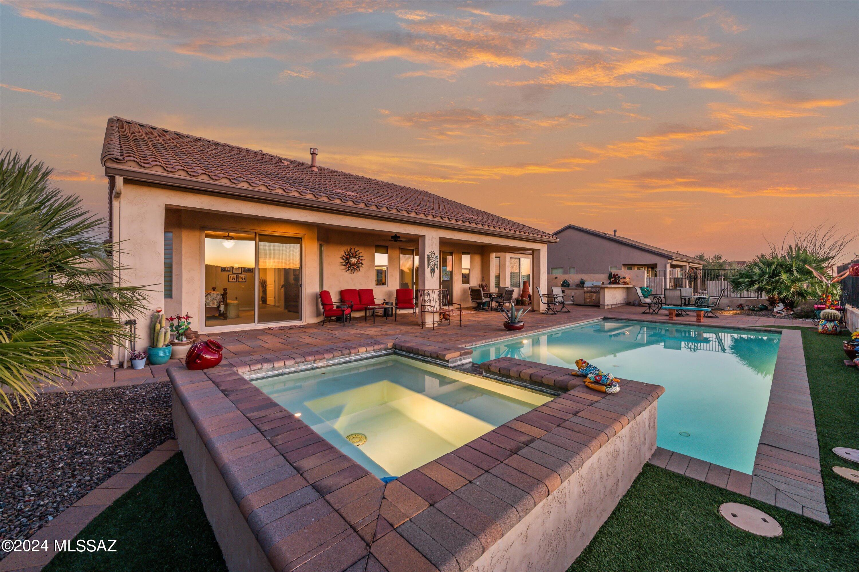 Imagine watching a glorious sunset behind a panoramic mountain view as you enjoy a drink by your lighted, heated pool & spa.  Or getting cozy by a beautiful fire in your great room.  It can be yours today with this lovely Covina model w/casita.  Kitchen has granite countertops w/full backsplash, oversize stainless sink, range hood, convenient desk.  Den/office w/built in desk & cabinets, can convert to optional bedroom.  Primary bed/bath has custom walk in closet & separate makeup vanity area, while large patio door looks out on pool & wonderful mountain views.  Generous covered patio.  Built in BBQ grill & Green Egg. Convenient casita for your guests or hobbies. Extended length garage has epoxy floor, golf cart garage, & work bench.  Add to that all the resort style amenities. Hurry!