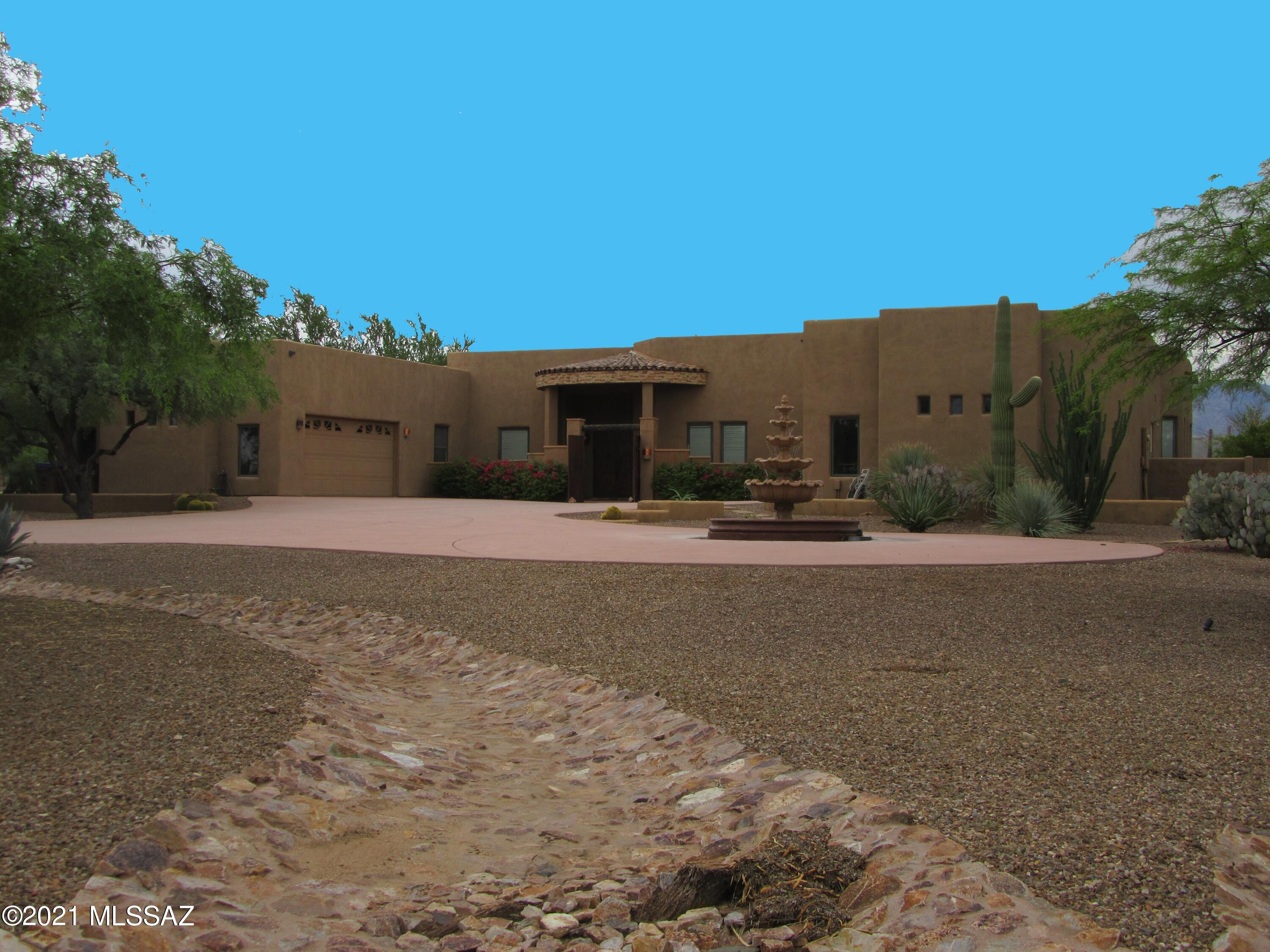 Rare find in Oro Valley!  This stunning 5 bedroom 6 bath plus den and exercise room retreat features timeless architecture on an acre of land. Ideal for indoor or outdoor entertaining with spacious living, dining, kitchen, and great room. Split floorplan with lots of room for everyone and  2 x 2 oversized garages. Other features include: Coffee Bar, Desk/work area, outdoor bar-b-que, and  pool and spa.  A must-see!