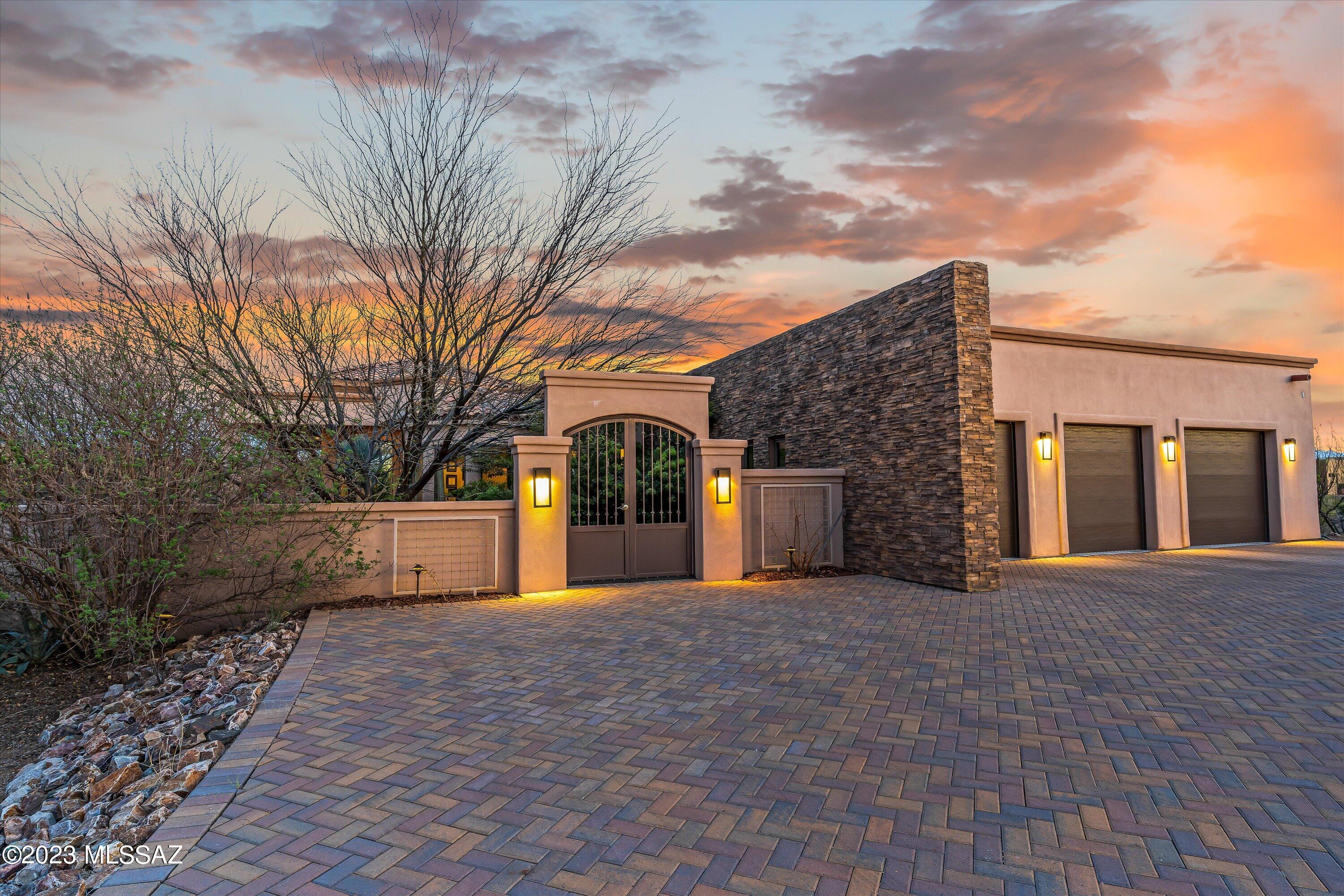 This magnificent custom home is situated in the tranquil Coyote Creek Gated Community, offering complete privacy & beautiful views. Enter into the private courtyard though double metal doors. Boasting 2742 square feet of living space
on 1.6 acres, there are three bedrooms with a split floor plan that includes two luxurious guest suites. The house was designed to optimize natural light through large Pella windows so you can enjoy your pleasant outdoor surroundings - including front & back paver patios that can work as two outdoor living rooms. Step into elegance with a luxurious master suite featuring porcelain tiling, granite countertops and
knotty alder doors and cabinets. When you need some extra storage space for your wardrobe essentials look no further than the custom-designed California Closet in this room. As if all of that wasn't enough, there's even private access to an idyllic garden retreat!  The impressive 1250 sf garage provides plenty of storage and work space, all garage doors are 8' tall and two are 8' wide and the third bay has a special 10' wide door which offers just enough extra room to fit wide mirrors of a pickup. Perfect for the handy person in your life. See Engineering Features in documents. With amenities such as recreation center and equestrian center, miles and miles of dedicated trails...Coyote Creek is a Lifestyle!