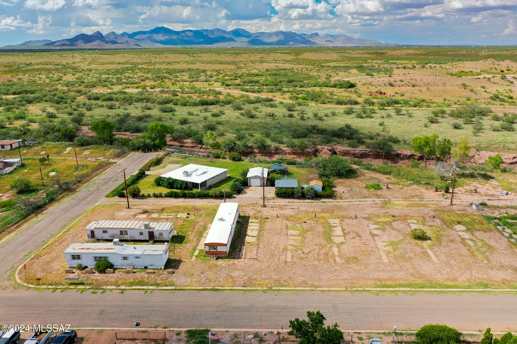 EXCELLENT OPPORTUNITY for investors. 3/4ACRE Zoned Multi-family/Residential. This is one of 2 available (301 E Yuma St) being sold AS IS.  Mobile home on the middle pad on the East side of the lot does not belong to the seller.  Huachuca City WILL NOT allow for mobiles to be put back in service for occupancy or development.  Utilities are at the property but will need to be confirmed depending on desired development.