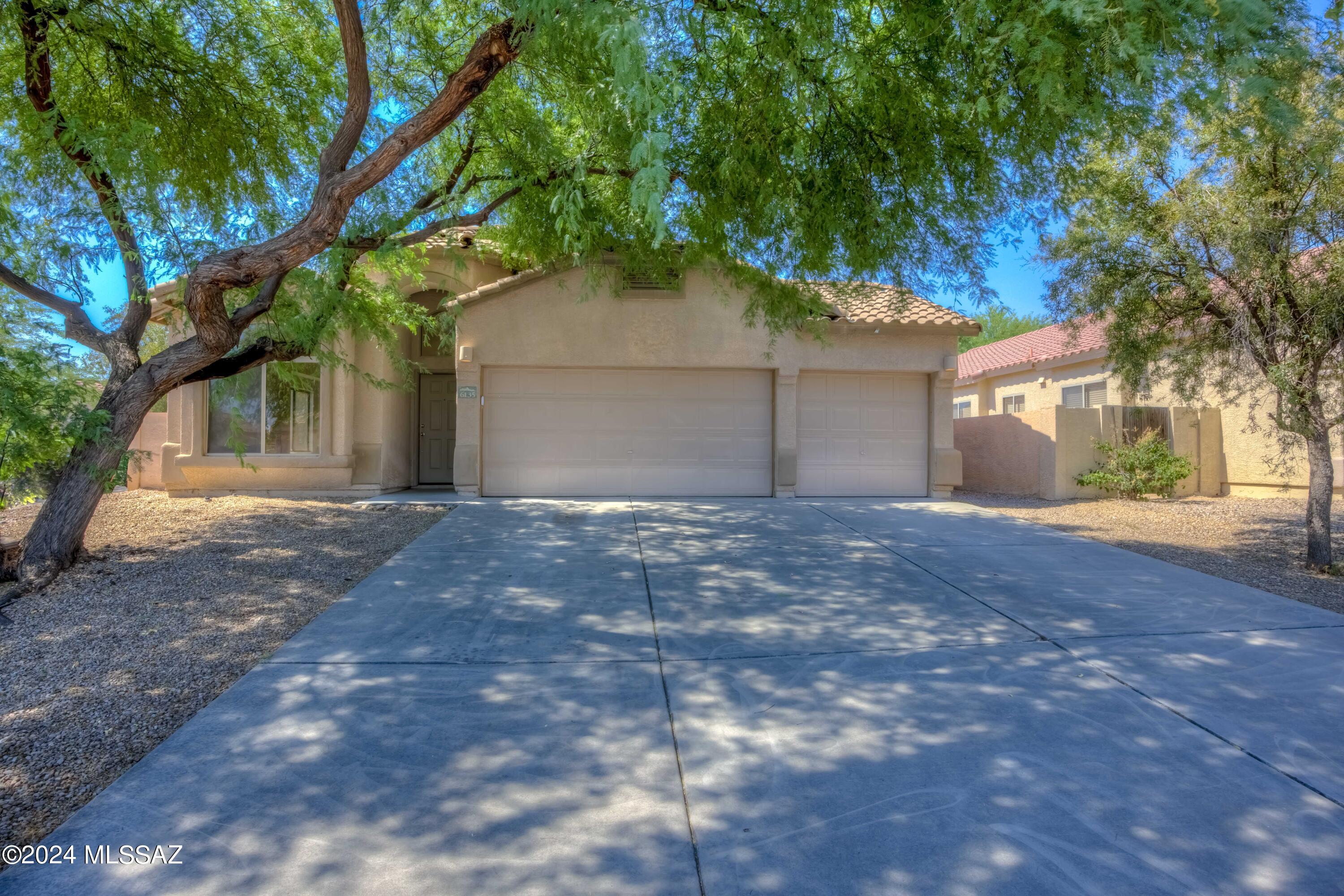 Discover this updated cul-de-sac lot gem boasting fresh paint & new carpet. Inside, the vaulted ceilings create a spacious feel from the open kitchen to the family room. Enjoy a newer A/C, gas fireplace & ceiling fans throughout. The kitchen features wood cabinets, an island, SS appliances, pantry &
dining area. Relax in the expansive primary bedroom w/ vaulted ceilings, ceiling fan & a primary bath offering dual sinks w/ new faucets, tub/shower combo & walk-in closet. Additional bedrooms share a full bath w/ updated faucet & toilet and Jack & Jill doors. Outside, a covered patio w/ electrical for
a fan overlooks a large private lot, perfect for outdoor activities. A three-car garage provides ample storage. This peaceful property blends modern comfort w/ serene Marana living!