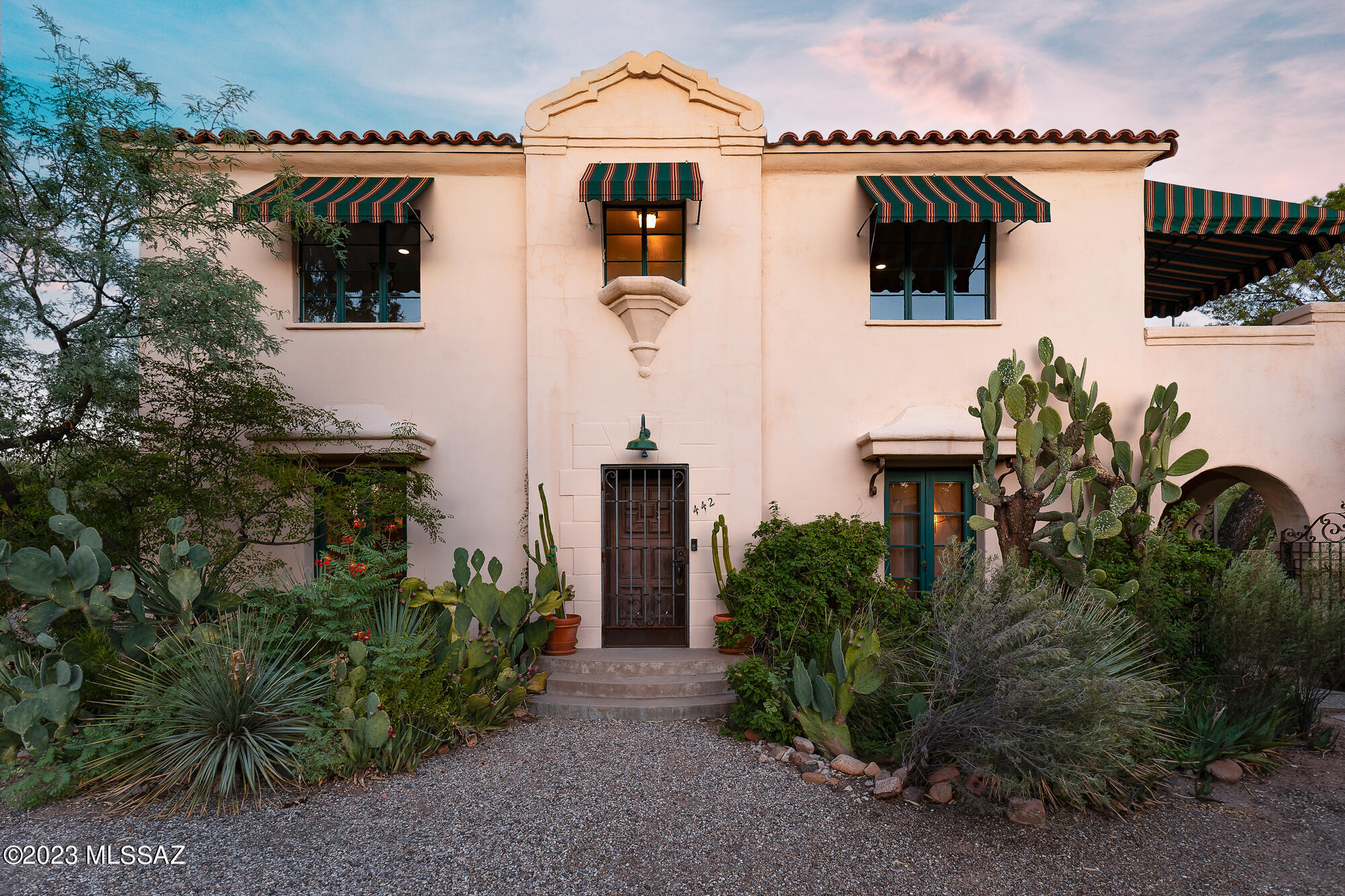 Welcome to this enchanting Spanish Revival built in 1932, one of the first homes in the historic El Encanto neighborhood. This meticulously maintained property boasts the timeless elegance of original details combined with modern updates. With a total of 4 bedrooms and 3.5 bathrooms, this home offers spacious living in a truly unique setting. As you enter, you'll be greeted by a formal living room featuring a wood-burning fireplace, perfect for cozy gatherings. The Arizona room, with its custom-made windows, provides stunning views of the lush garden, making it an ideal spot for relaxation and enjoyment of the outdoors. The kitchen has been thoughtfully updated with newer appliances and modern amenities. Situated on 0.38 acres, the property features a thriving and serene garden, creating a peaceful oasis in the heart of Tucson. 
Located in the historic El Encanto neighborhood, you'll have the privilege of living in one of Tucson's most sought-after areas. Enjoy the convenience of nearby schools, parks, and shopping.