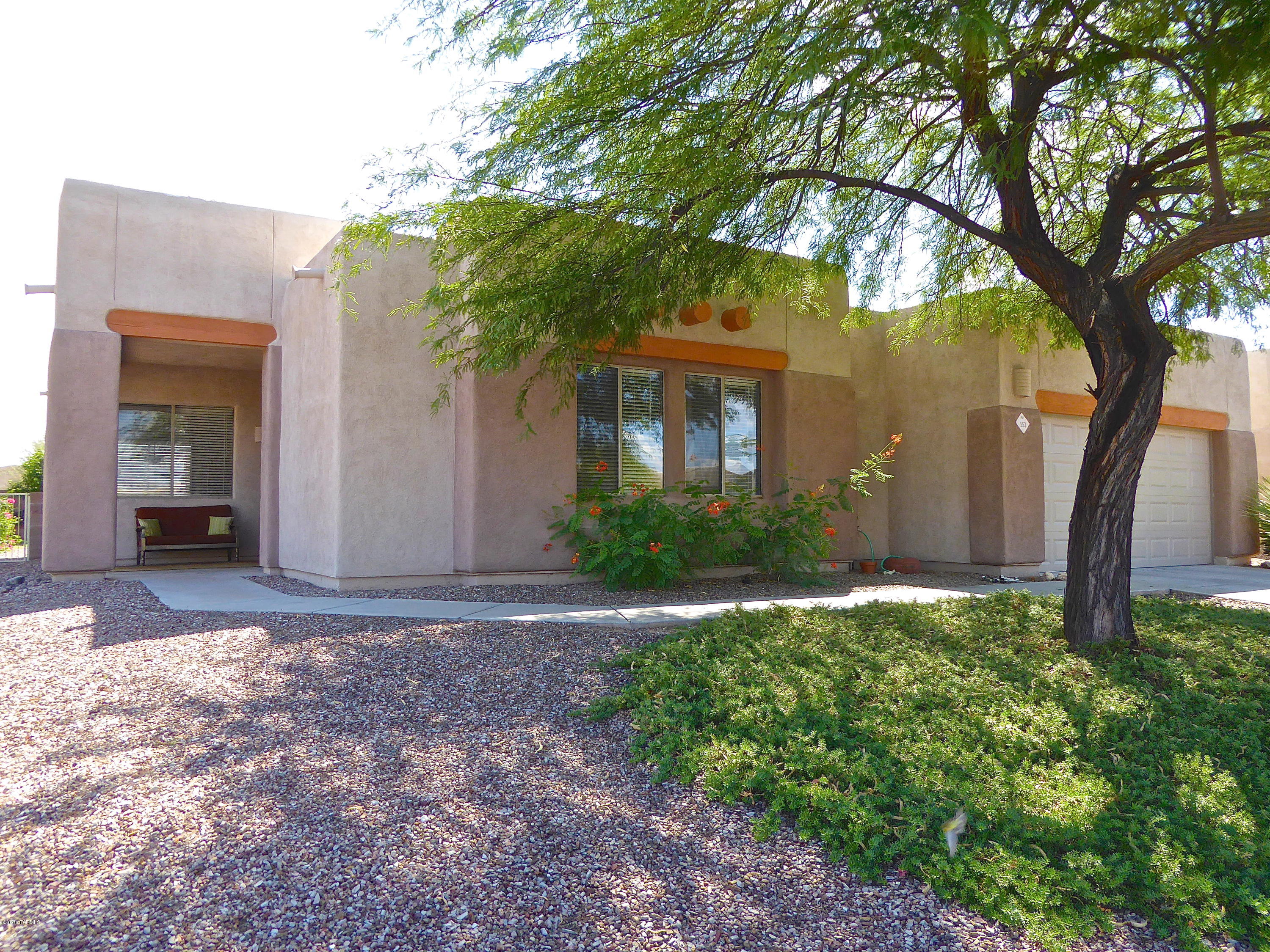Stylish Southwest Contemporary home on a high corner lot with mountain views. 3bedroom, 2-full bath, Sparkling pool-solar heated. Fully landscaped yard with mature vegetation. High Ceilings, window seats. Ceramic tile floors in much of the home, carpet in the bedrooms. Roomy master suite, Master bath with double sinks, garden tub and separate shower. Island kitchen with Brand new stainless steel appliances; gas range, refrigerator, micro-wave and dishwasher. Extra length 2 car garage. This is a well cared for Original owner home.