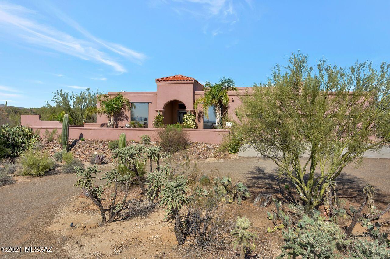 Open houses 4/16-18. See OH tab for times. Tucked away on a peaceful 3.5 AC parcel of desert glory is this beautiful home w/ all the features you desire: privacy/views/PAID solar/no HOA/natural gas/city water/3-car garage. The backyard is your own private resort: relax on the deep covered patio with majestic Catalina Mountain views, cook in the outdoor kitchen, swim in the solar heated pool, soak in the solar/gas heated spa, work on your short game on the putting green, listen to the soothing sounds of the rock water feature, enjoy panoramic views of sunrises/sunsets/towering saguaros from the rooftop deck. The circular driveway brings you to the front courtyard, currently in spring bloom, offering a wood-burning fireplace for chilly evenings and a gentle water feature.