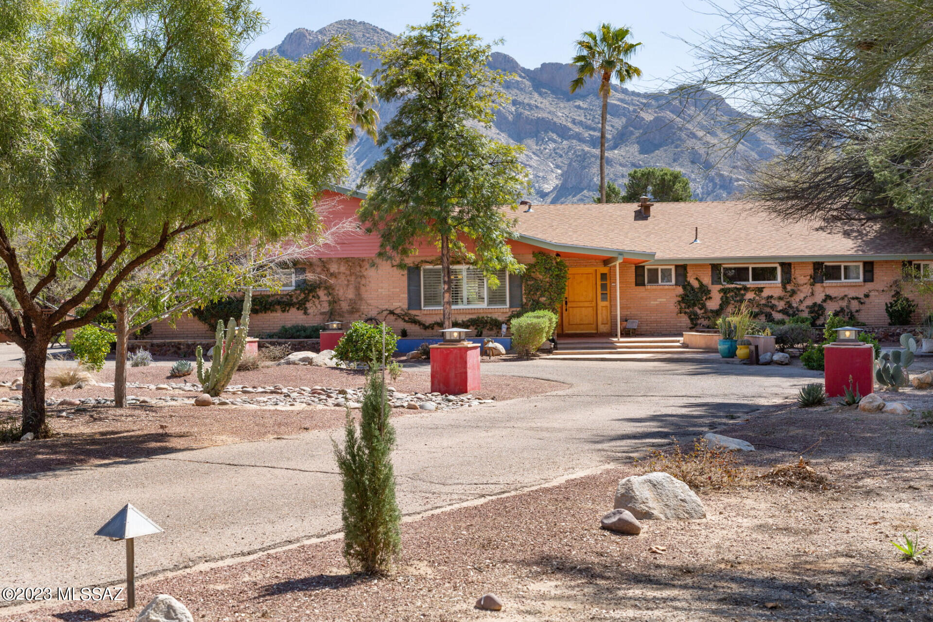 In Oro Valley Country Club on the 6th fairway, classic midcentury home situated with dramatic uninterrupted Pusch Ridge views! Benevolently
known as the Buckelew House featured in the Arizona Daily Star, 1965. 4 bedroom home
ideally situated on nearly one acre with privacy from the street and golf course with
East/West orientation providing shaded, stunning sunsets. Old-Tucson style brick floors
throughout. Remodeled gourmet kitchen with pecan cabinets and two multi-compartment
sinks for prep and post meal management. Anderson windows, A/C 2020, Pebbletec pool,
dual roman showers. Alder exterior doors and flagstone entry make this home a warm and
welcome respite for entertaining friends or bonding with families. A home with heritage and
heart to enjoy inside and outside!