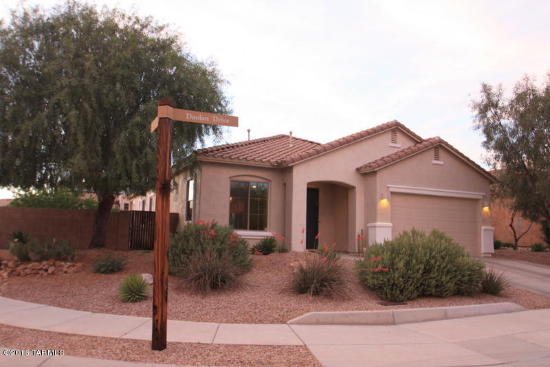 Beautifully situated corner premium lot split floorplan single story home.  Meticulously maintained 3 bedroom plus  den with 2 bathrooms in Rancho Vistoso.  Beautiful natural light throughout the home. Large upgraded  kitchen with granite countertops and stainless steel appliances including an island breakfast bar.  Abundant cabinet and counter space.  Open floor plan, excellent for entertaining.  Professionally landscaped oversized backyard with your own Tangelo, Lemon and Grapefruit trees.  Two car garage and across the street from a small nature trail. Floor plan available upon request.