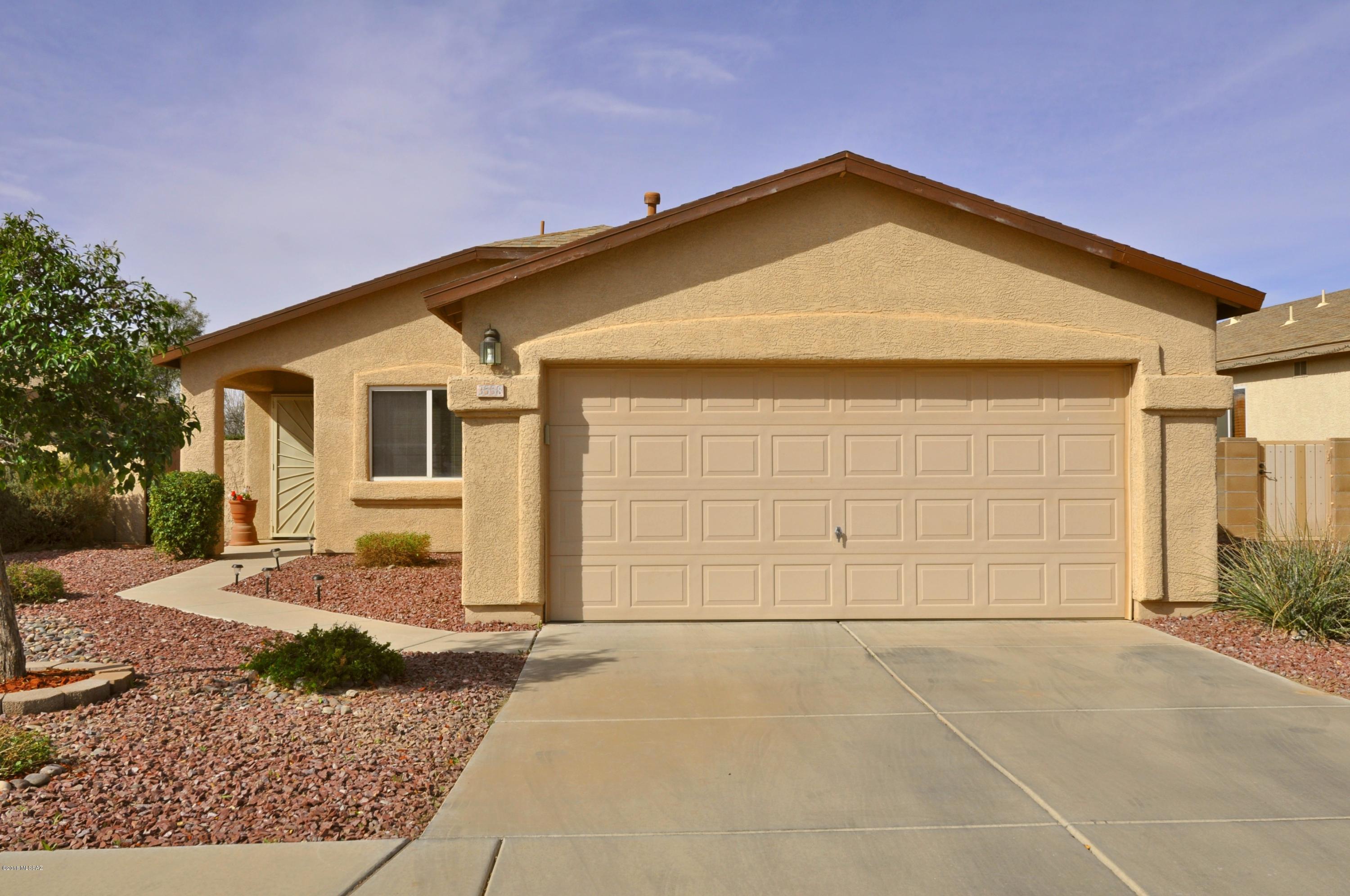 Be part of a 42 Home Enclave on the edge of town! Beautiful setting w/ Elevated lot with view of the trees behind & peek-a-boo mountain views. Full length cov patio approx. 34x8 Ft! Artificial turf & flowering plantings! REFRESHING CONVENTIONAL POOL with Lagoon Waterfall! Updated AC Condensor for max efficiency! Travertine-look tile in all living areas. Neutral carpet in Bedrooms. Vaulted ceilings in living, dining, kitchen & Owner's BR! Honey Oak kitchen w/full set  of appliances including updated self-cleaning range! If you've thought of taking up horseback riding - there are several boarding/training stables within walking distance! Pantano Wash just down the street - for dog walking or trail running! Fantasy Island bike trail is a mile south! Plus, super easy access to DM and PCC!