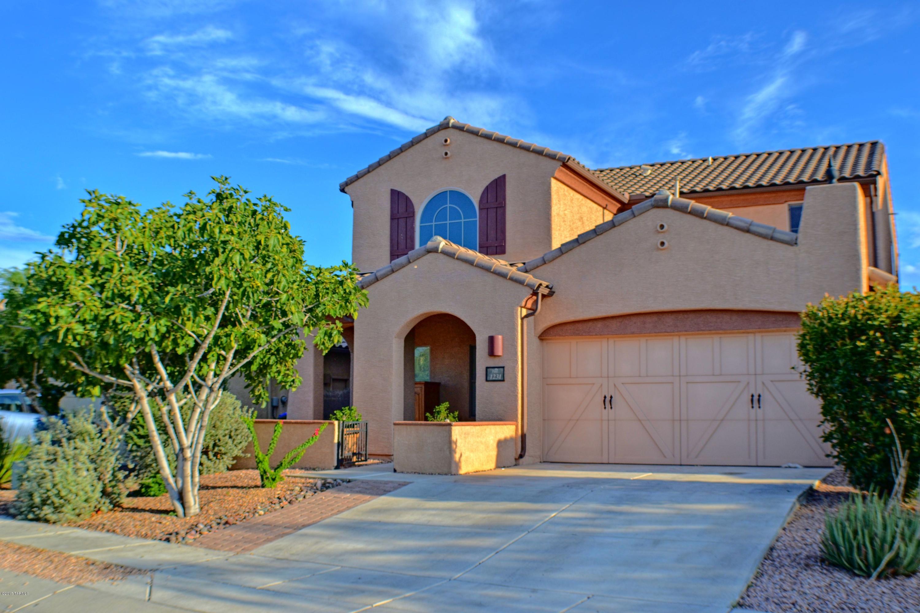 Cortona at Rancho Vistoso 2795SF, 4BR/3BA, plus den - ready for move in!  Catalina and Tortolita Mountain views.  20'' tile in formal dining, living, kitchen and baths. High ceilings. Lots of natural light. Wood banister staircase and loft area. Loft area with cabinetry and counterspace. Extra large storage closet under the stairs. Anteroom with custom tile inset separating kitchen from formal dining. Kitchen with granite, stainless, and beautiful cabinetry with crown moulding. Master bedroom and bath conveniently located downstairs. Slider access to back patio and backyard from Great Room. Backyard with gardening box, grass, & mountain views. Courtyard entry & covered patio. Quality 2x6 Construction. Impeccable home at an amazing price - don't miss this one!