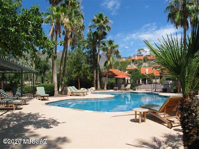 Tierra Catalina in the Foothills. Fully  furnished 2nd floor unit with 2 bedrooms, 2 baths. High ceilings, popcorn removed, plenty of natural light through-out.  Energy saving double pane windows, newer kitchen appliances and newer A/C. Ceiling fans in each room. Large laundry room with storage. Spacious kitchen with breakfast nook that leads to a private covered balcony. Beautiful community pool & spa with tennis, clubhouse and fitness center. Convenient to La Encantada with upscale shopping & restaurants, Starbucks, and Westin La Paloma Resort & Spa. District 16 schools.