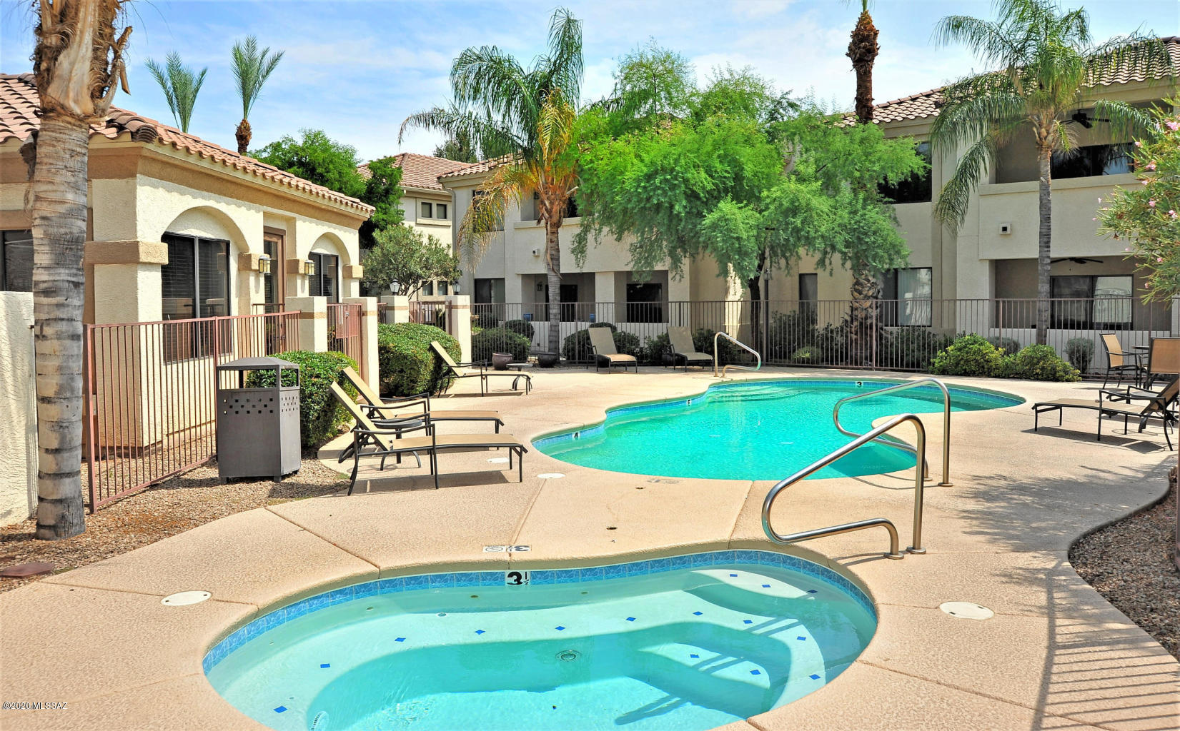 Updated and move in ready 1,036 Sq Ft 2 bed/2 full bath all electric condo located in desirable The Villas at Hacienda Del Sol. Affordable Foothills living, gated community located close to St Phillips Plaza, The Union, La Encantada, Racquet Club and on the Rillito paved River Path (gated entrance to path from complex). Monthly $194 HOA dues include:  Video surveillance gated entrance, reserved covered parking space (#171 close to unit), water, trash, sewer, multiple sparkling pools (one heated), spas, gym quality fitness center, road and landscape maintenance, barbecue areas and clubhouse. Coveted top floor location (no stomping feet or noises above you), low maintenance 1,036 Sq Ft unit. Updated & remodeled features:North facing covered private balcony w/Catalina mountain views CONTINUED brand new HVAC July 2020 (16 SEER 2.5 ton 10 year warranty), Nest thermostat, energy efficient double pane windows, (electric bill ranges between $35-$75 a month) textured ceilings (no popcorn), built in sprinkler fire suppression system, fresh paint, tile flooring, ceiling fans, modern fixtures, full slab granite counters in kitchen & both bathrooms, breakfast bar, dining area, slider out of master bedroom and washer & dryer included in separate laundry/storage room. Walking distance to restaurants, jogging/biking trail, bars and shopping. 10-15 minutes away by car to Banner Medical or the University of Arizona. Fantastic solution for seasonal visitors, parents looking for secure student housing, investors, first time home buyers and/or professionals looking for low maintenance housing. List of furniture included with sales price: Red sofa (full size pull out bed) living room, queen bed + head board Master bedroom, full size bed + head board guest bedroom, 2 bar stools. Come view for yourself today!