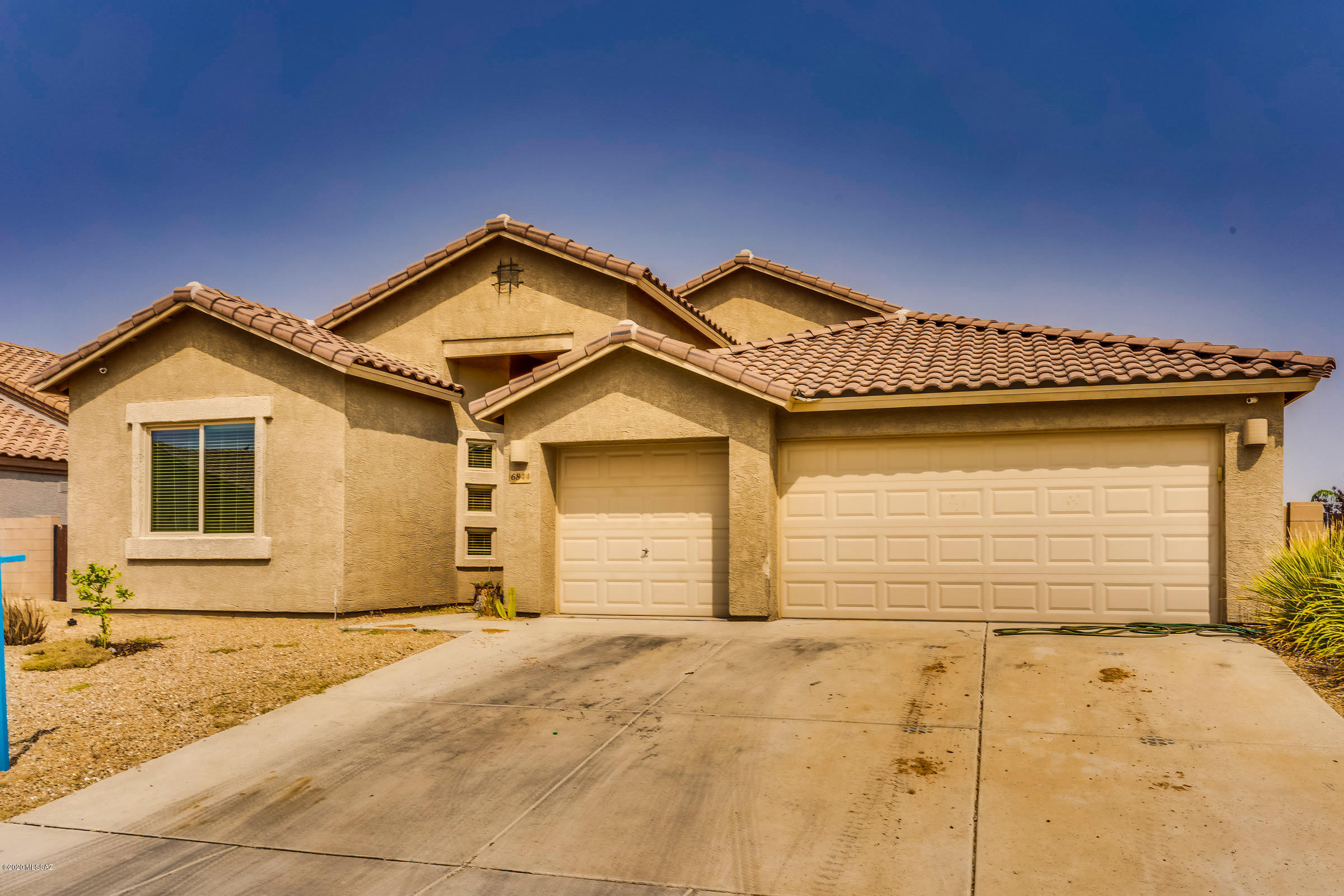 Live a comfortable future with this newer property in Star Valley! This home has the perfect amount of square footage and space for a large family. It boasts  numerous multi use Living/Dining areas, high ceilings, ceiling fans throughout, beautiful open kitchen w/ lots of cabinet space, stainless steel appliances, black granite counters and a gas range. Use the large spaced 3 car garage  for all of the  family toys. The Family room exits to a great entertaining  backyard with fireplace, hot tub, synthetic lawn, and built in grilling center. Large Master suite w/garden tub,  separate shower, & large walk in closet, with its own door to the back patio.  This great neighborhood is close to schools, parks, and the ease of commuting to the interstate. Come  see this home and make it yours.