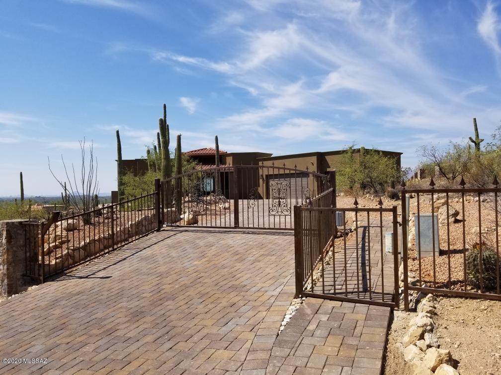 THIS IS IT!
New Construction
It simply  doesn't get any better, gated-location, dyed scored concrete floors throughout, 360 views, overlooking the best park in Tucson, Agua Caliente which abuts this property. This is on the national register of historic places.
Fantastic custom kitchen, amazing master suite, 2 additional master bedrooms, large 3 car garage, views from every window in the home, $15,000 custom 9ft by 4ft wrought iron entry door, upgrade after upgrade. This is the best home I've seen in 40 years of living in Tucson. 15 minute drive to tanque Verde falls, 5 minutes from 49er golf course, 50 minutes from MT Lemmon Ski Resort, 35 minutes to Rose Canyon Lake stocked with rainbow trout, 10 minutes to Tanque Verde Ranch 4 star resort with restaurant and horseback riding.
