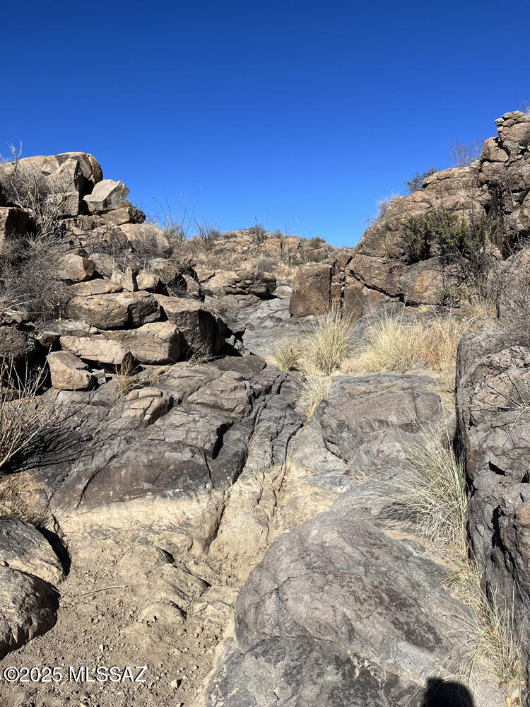 This standout private land captures endless sunset & sunrise views stretching across the Santa Rita mountains. With untouched gated desert allows for off-grid living in peace and quiet solitude. Just up the highway is access to the Tumacacori National Historical Park or Tubac's Golf Resort & Spa. Down the way is Sonotia's wine country with Sonoita Creek Natural Area. Wether it be hiking, biking, horse ridding or birding, this can all be done from your secluded slice of desert oasis. Let's make this dream come true!